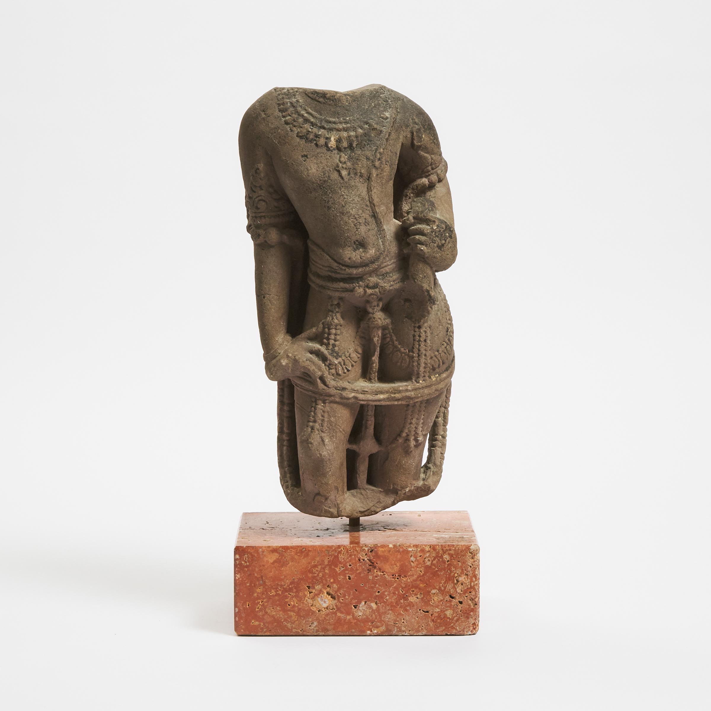 A Stone Torso of a Male Deity, India, 12th Century or Later