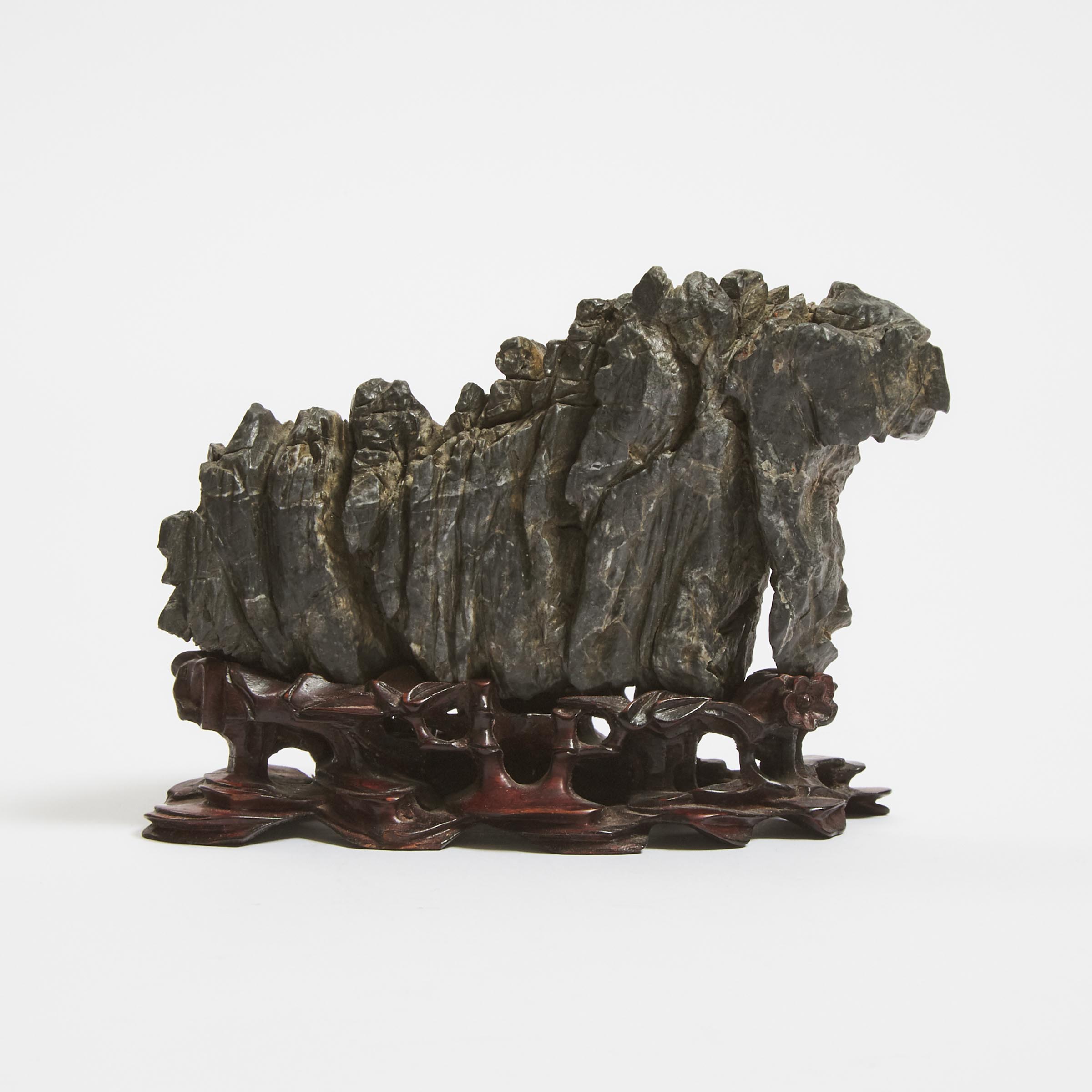 A Miniature Chinese Lingbi Scholar's Rock on a Carved Hardwood Stand