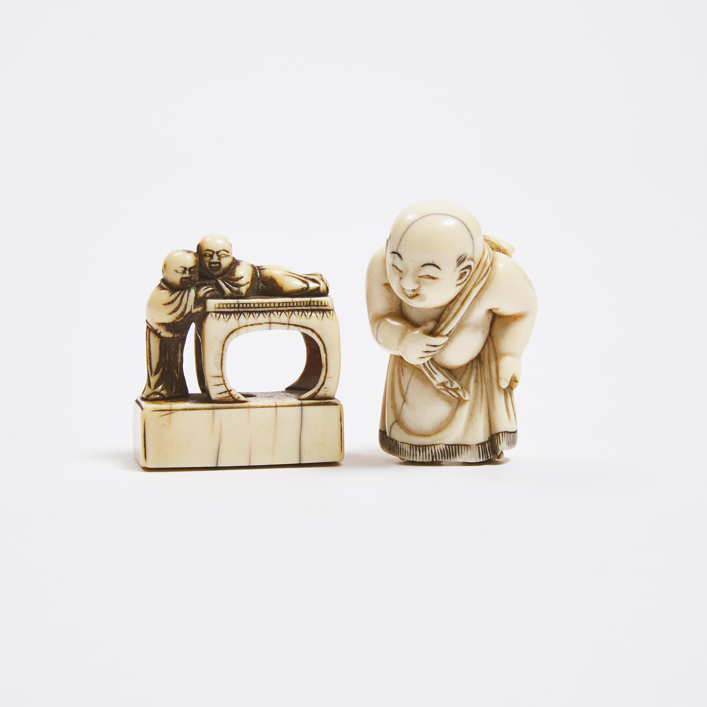 An Ivory Netsuke of a Child Sumo Wrestler, Together With a Seal-Form Netsuke of Two Children, 18th/19th Century