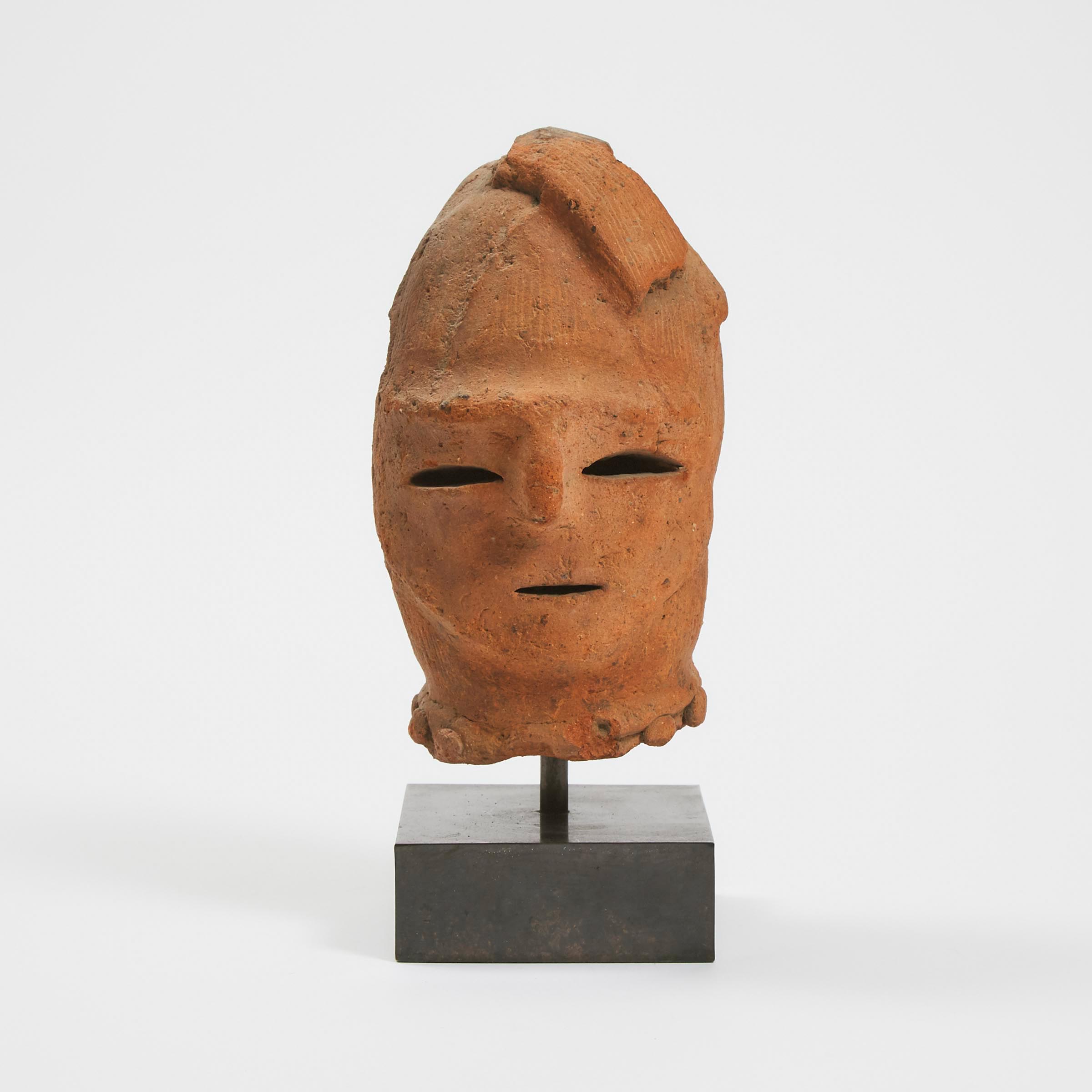 A Japanese Earthenware Haniwa Head, Probably Kofun Period (Circa 300-593)