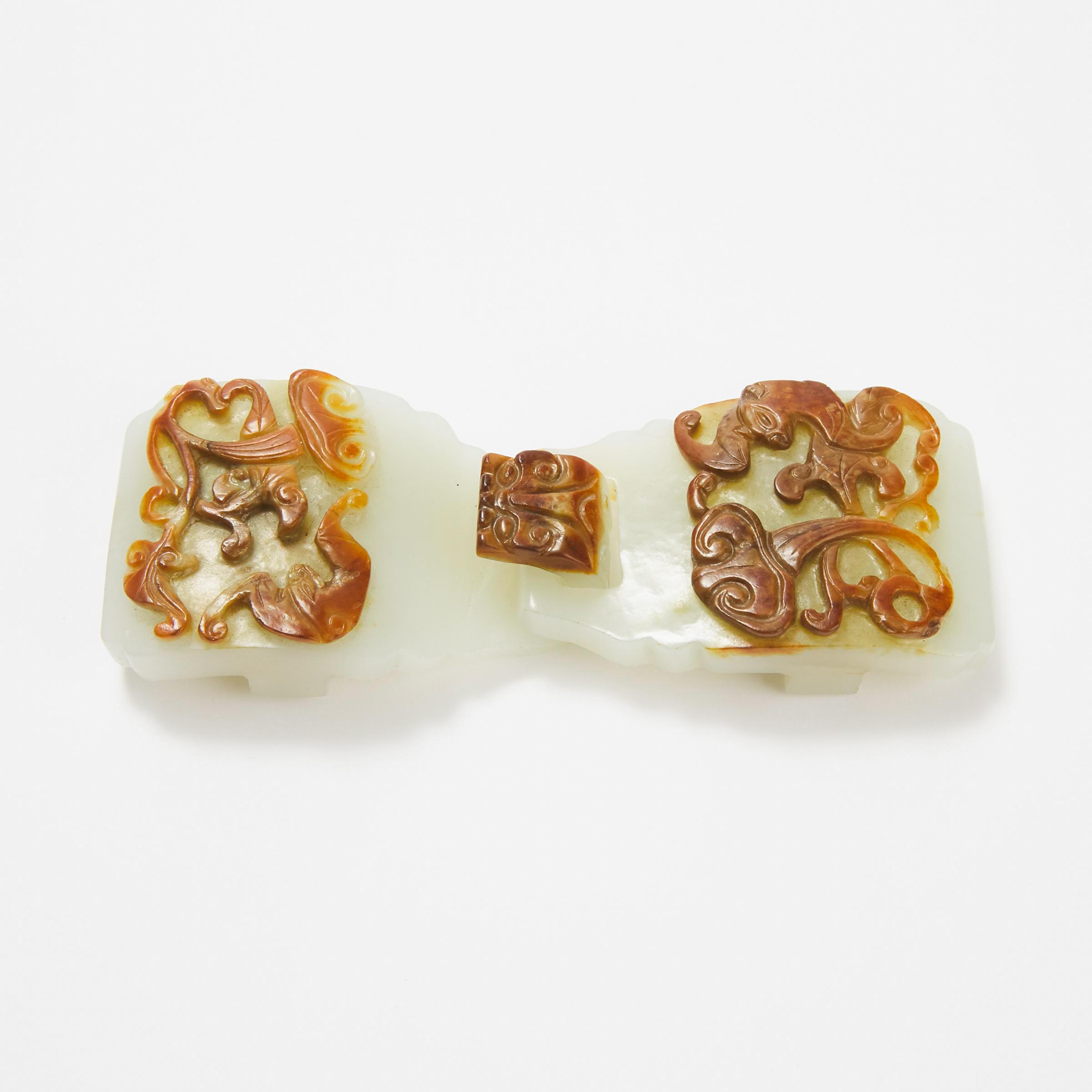 A Carved and Pierced White and Russet Jade Belt Buckle, 18th Century
