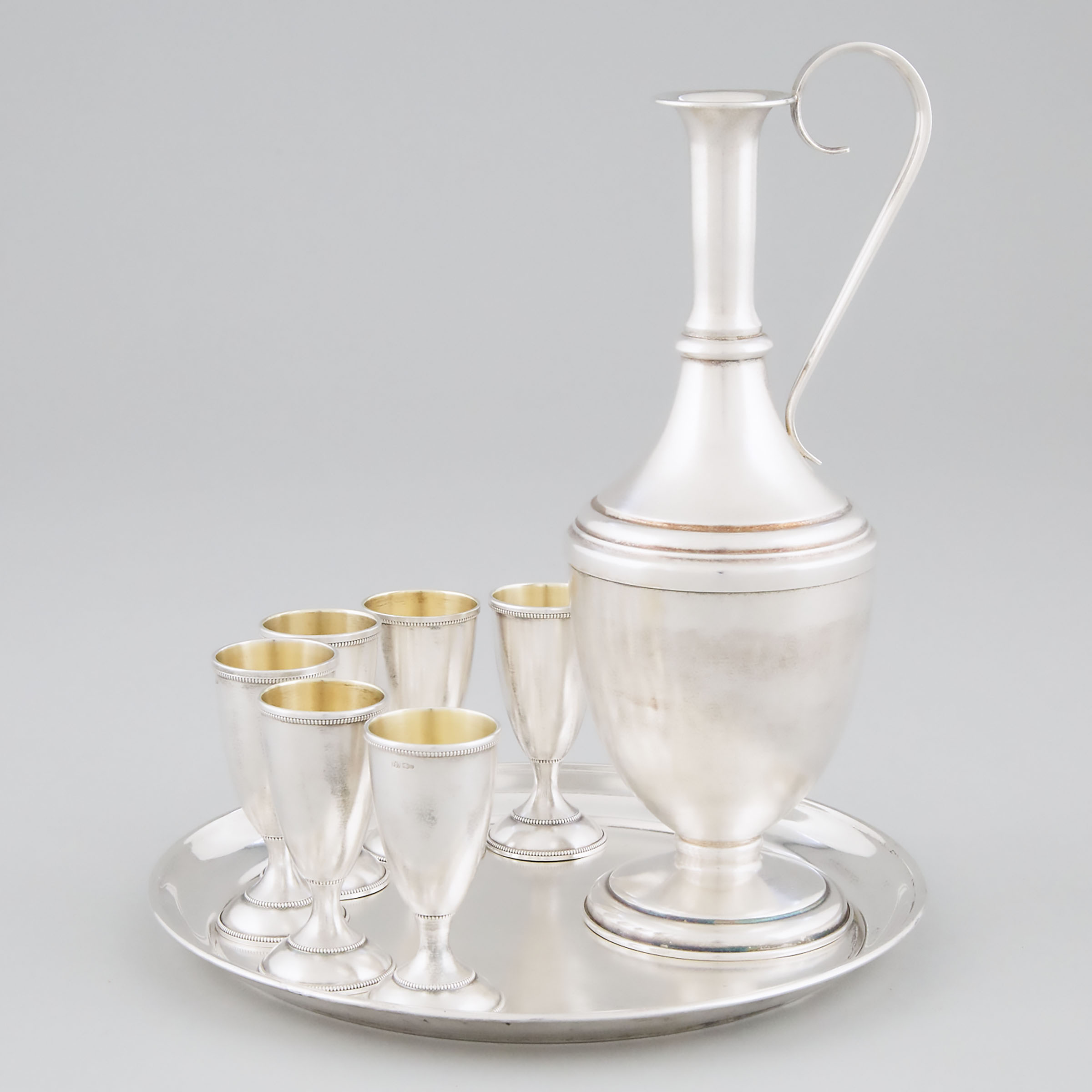 Russian Silver Vodka Carafe, Six Cups and a Circular Tray, 20th century