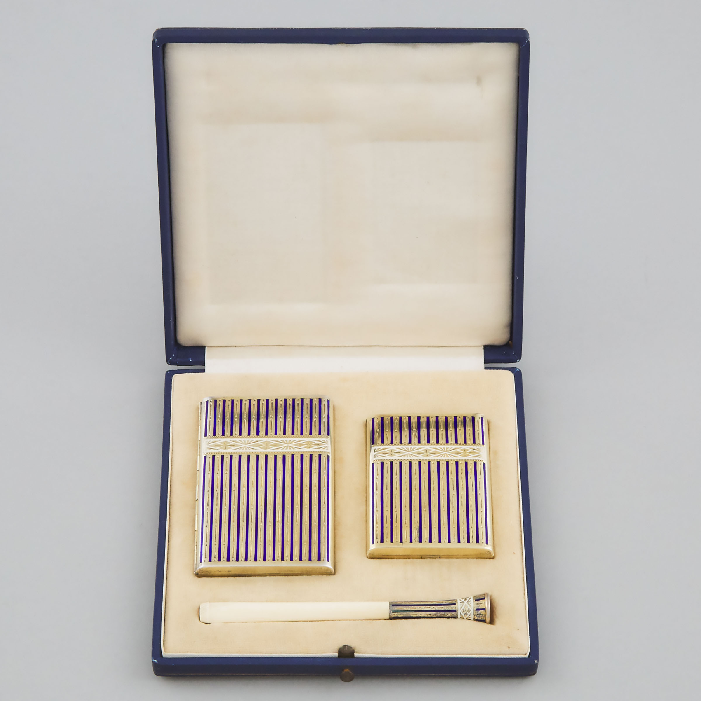 Enameled and Engraved Silver-Gilt Cigarette Case, Card Case and Cigarette Holder, 20th century