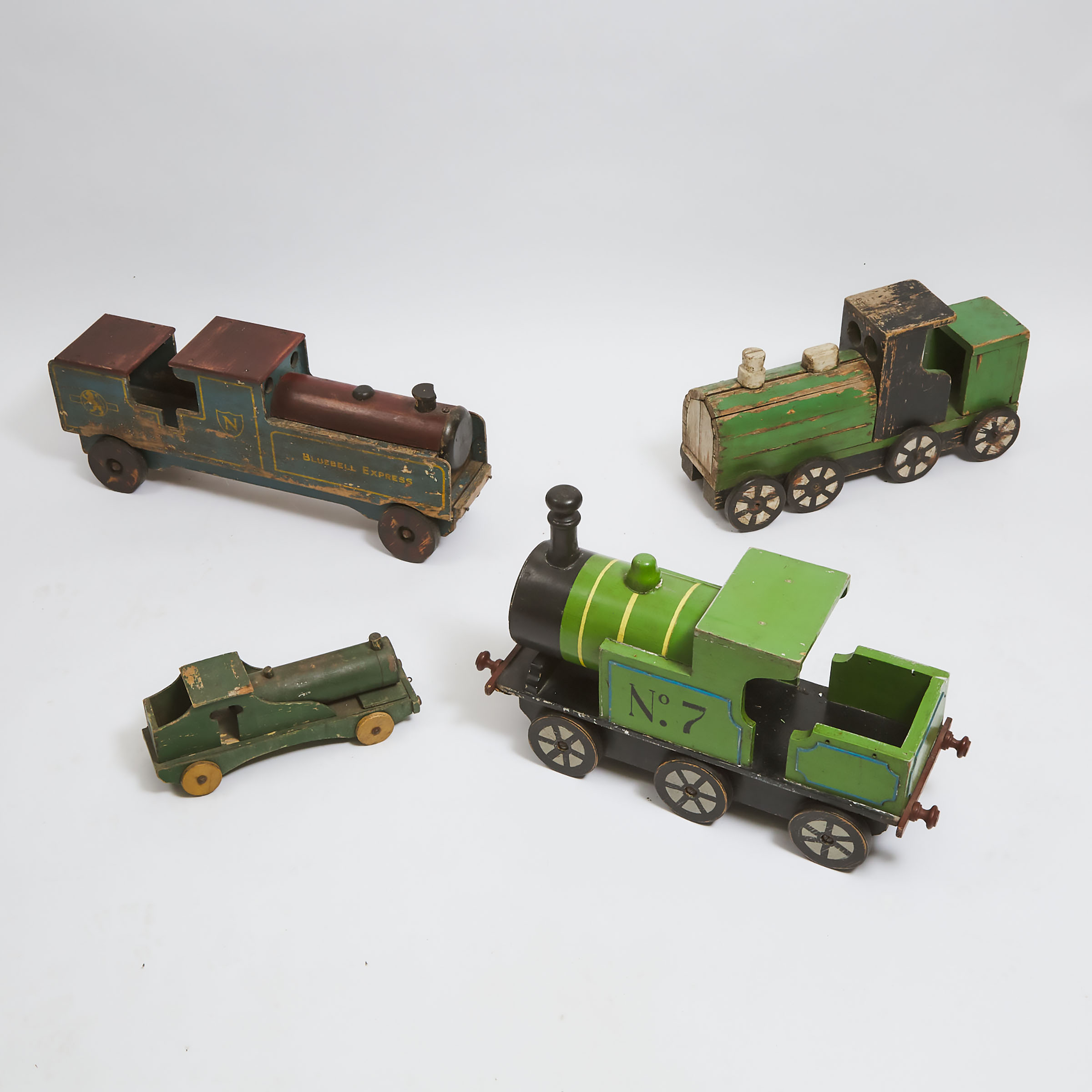 Group of Four Painted Wood Toy Train Engines, early-mid 20th century