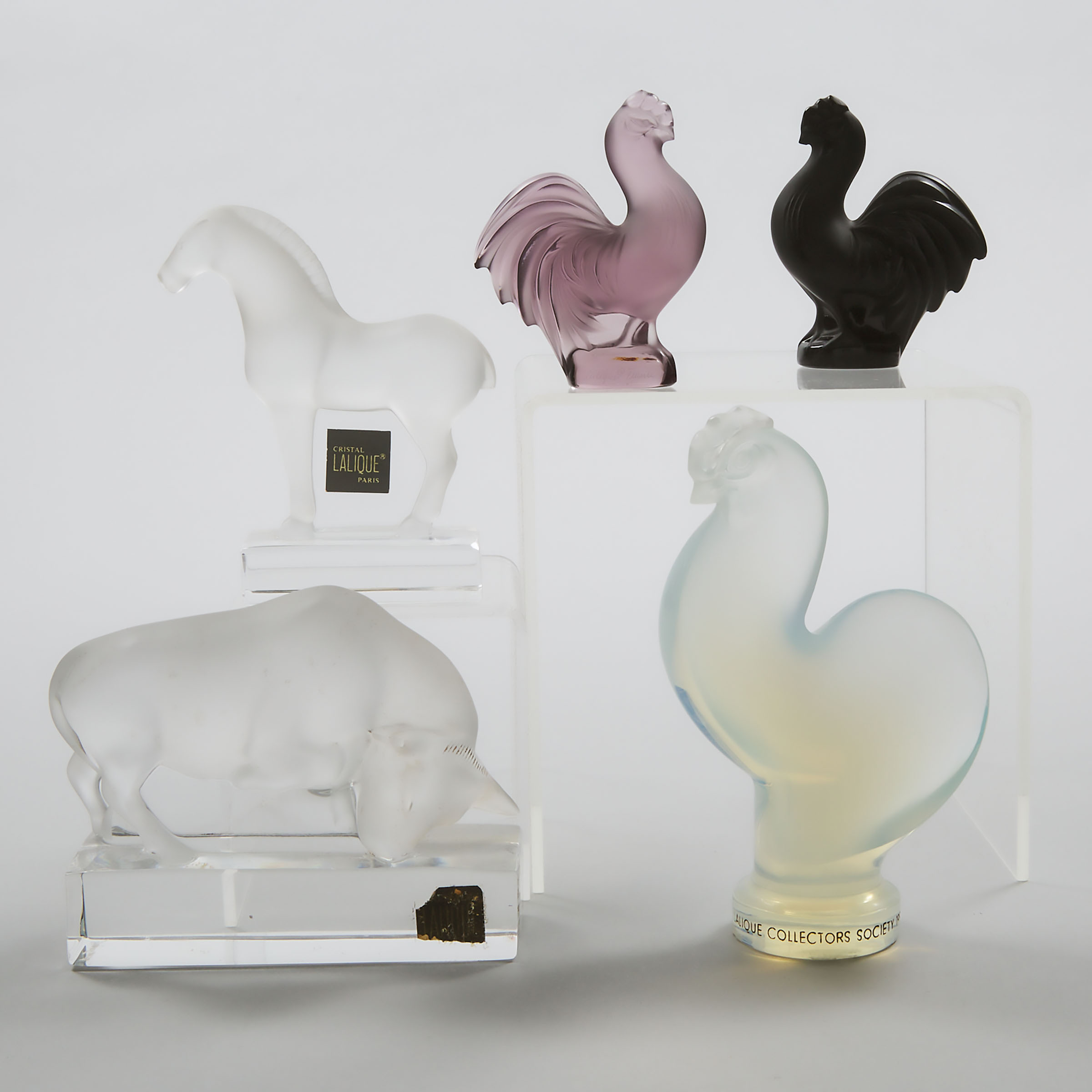 Three Lalique Coloured or Opalescent Glass Models of Roosters, a Buffalo, and a Horse, 20th century