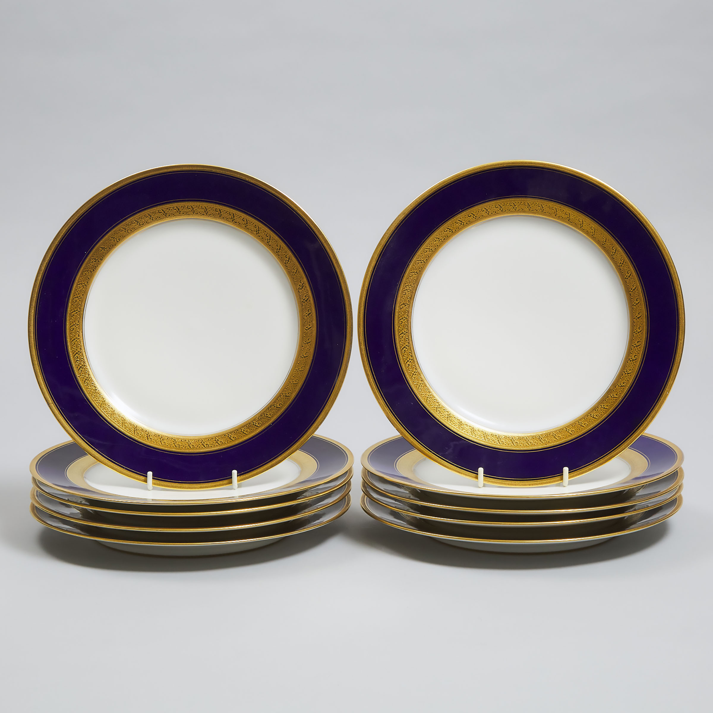 Set of Ten Charles Ahrenfeldt, Limoges Blue and Gilt Banded Service Plates, for William Junor, Toronto & Hamilton, 20th century