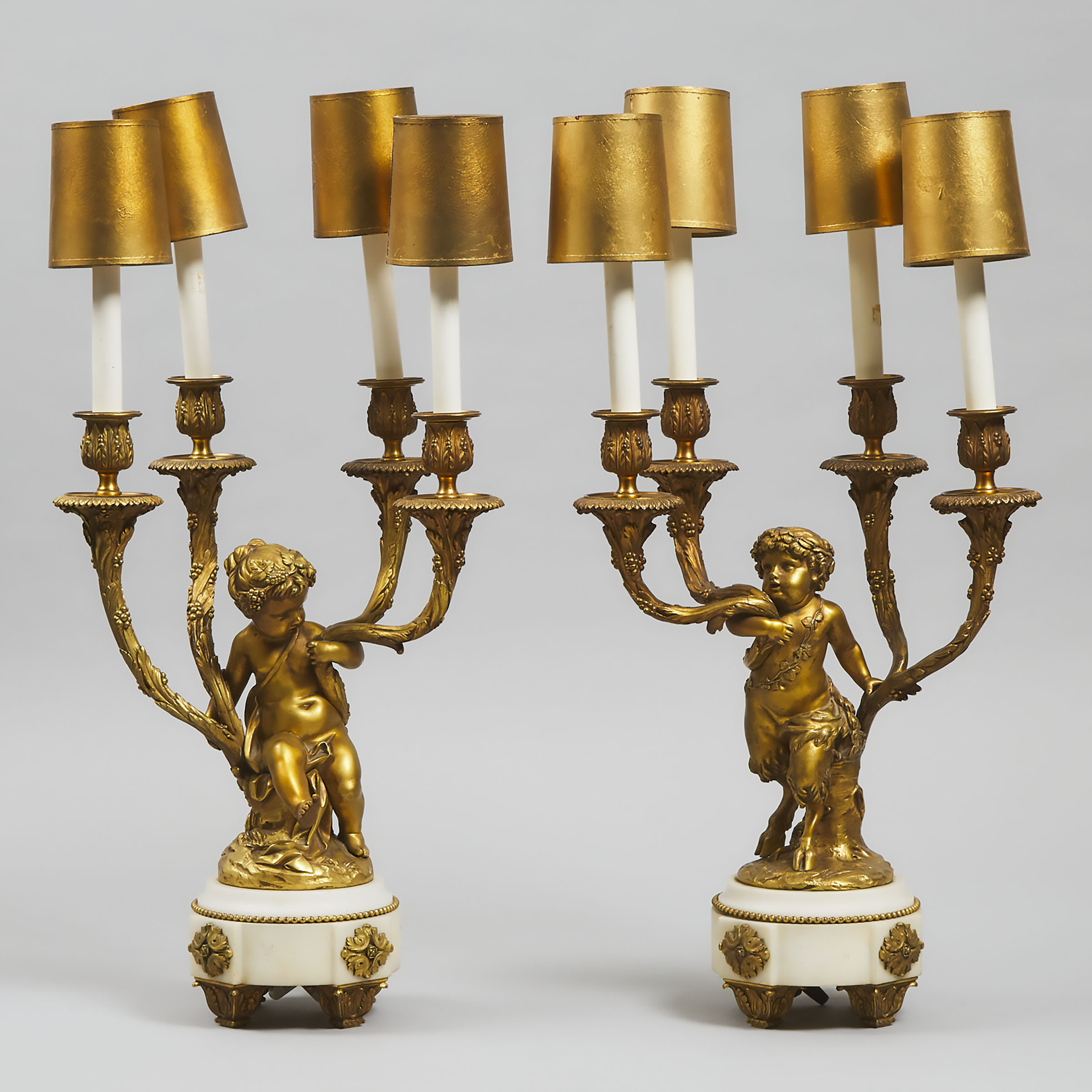 Pair of Louis XV Style Gilt Bronze and White Marble Figural Candelabras, first quarter of the 20th century