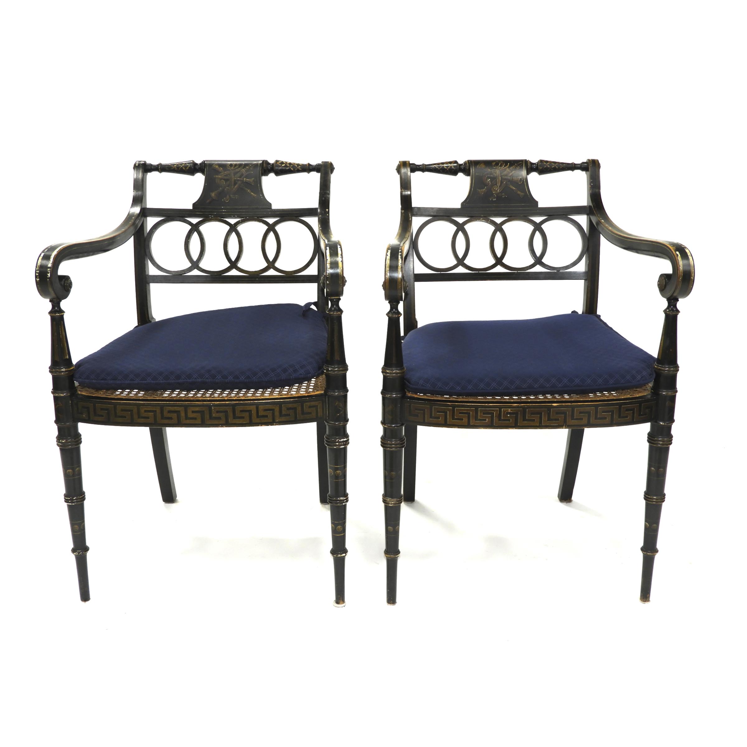 Pair of French Directoire Ebonized and Parcel Gilt Open Armchairs, early 19th century