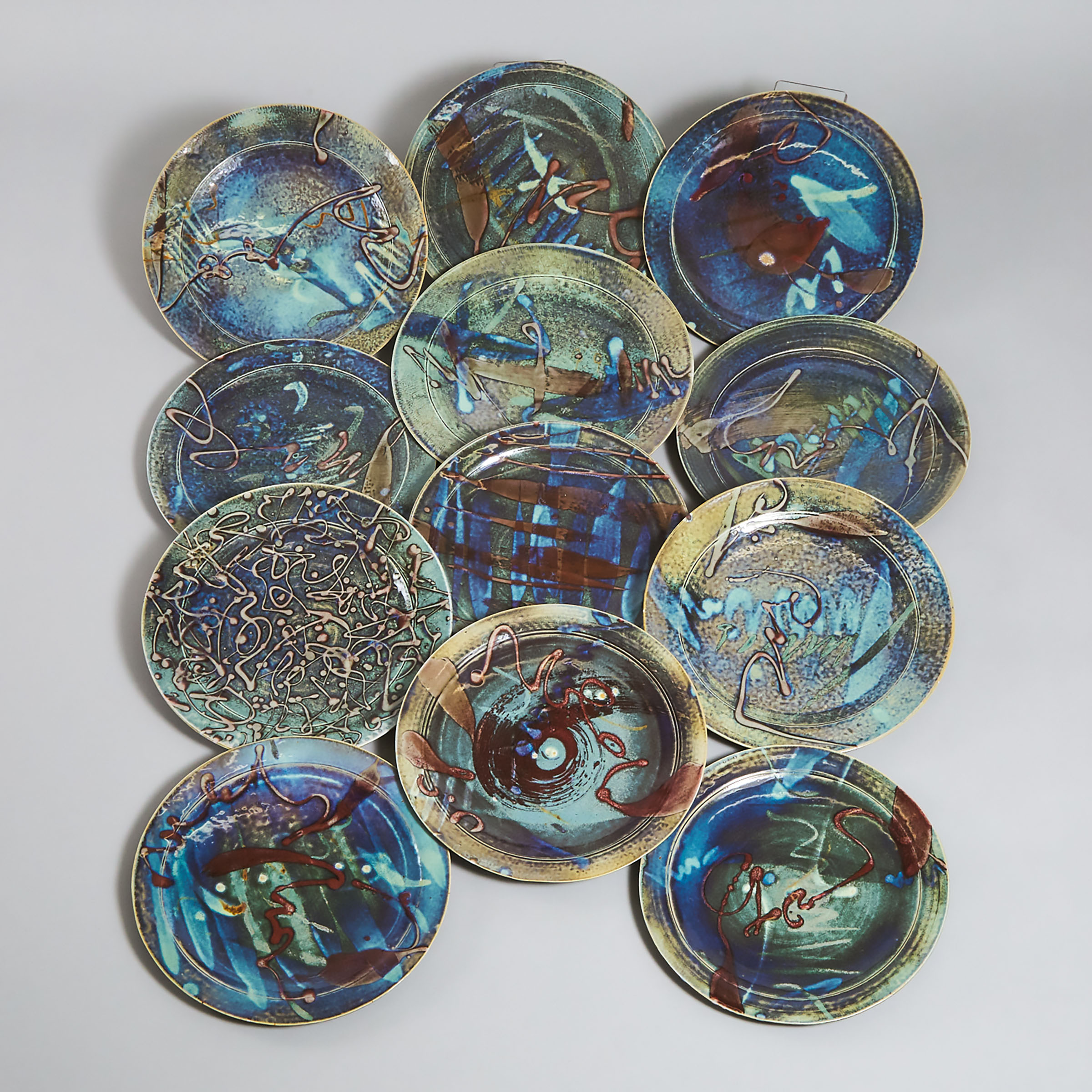 Kayo O'Young (Canadian, b.1950), Twelve Blue and Red Glazed Dinner Plates, 1989/90