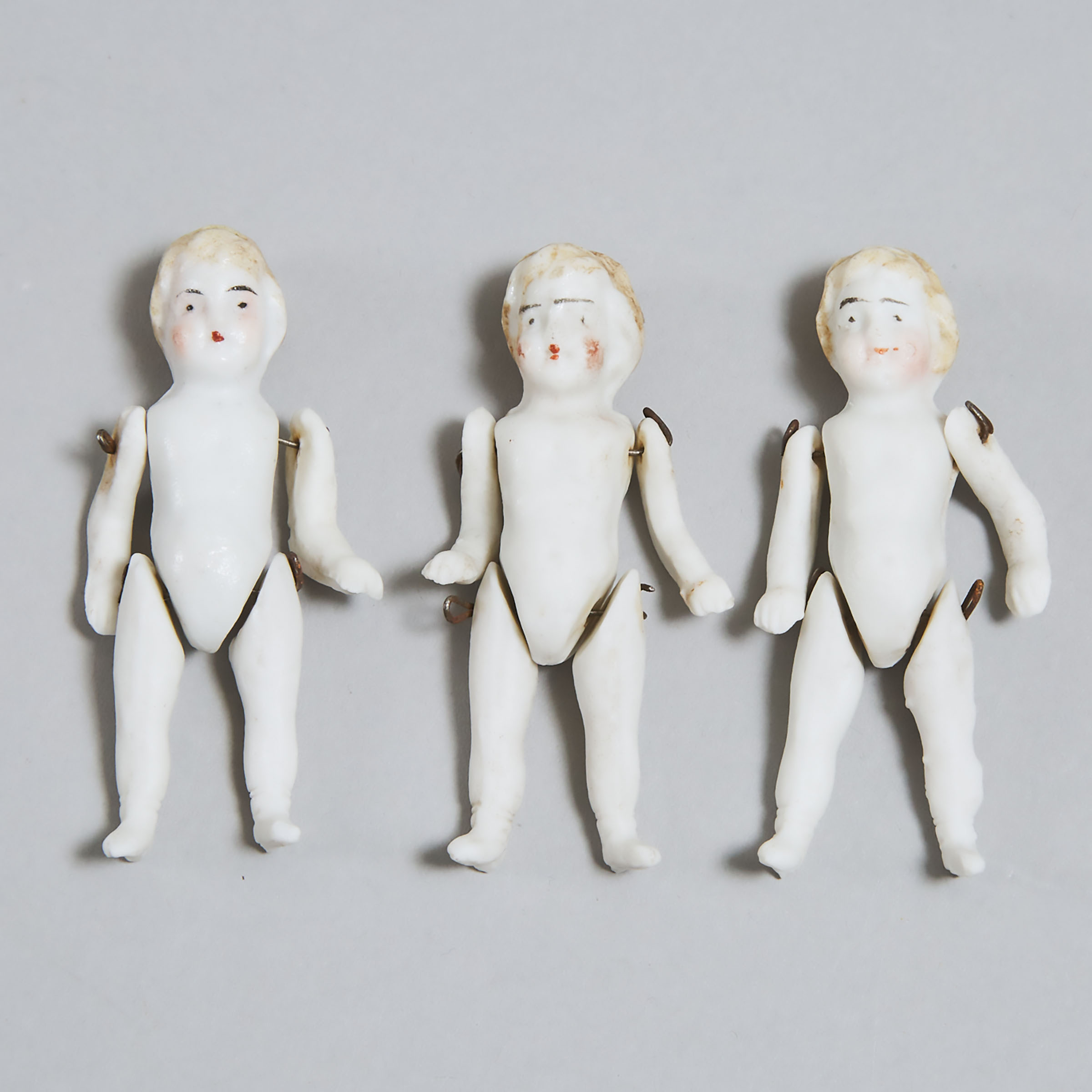 Three Miniature German Articulated Bisque Dolls, 19th century