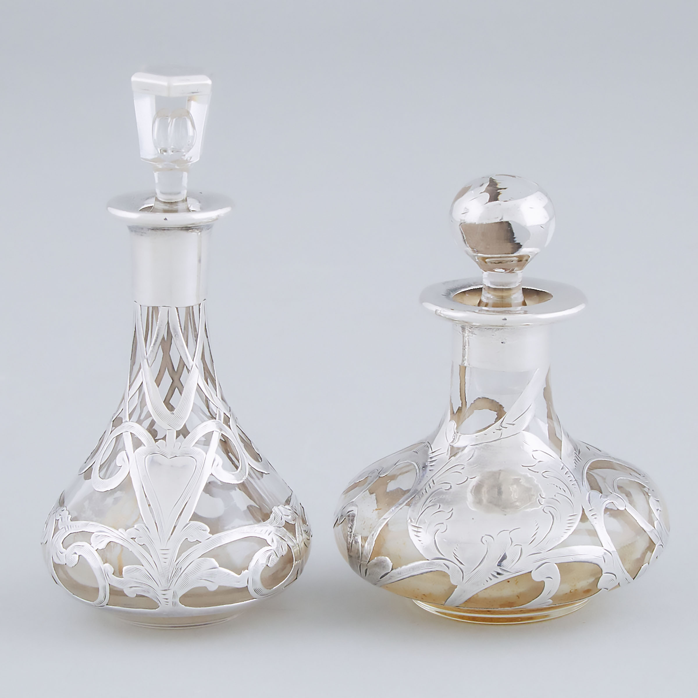 Two American Silver Overlaid Glass Perfume Bottles, early 20th century
