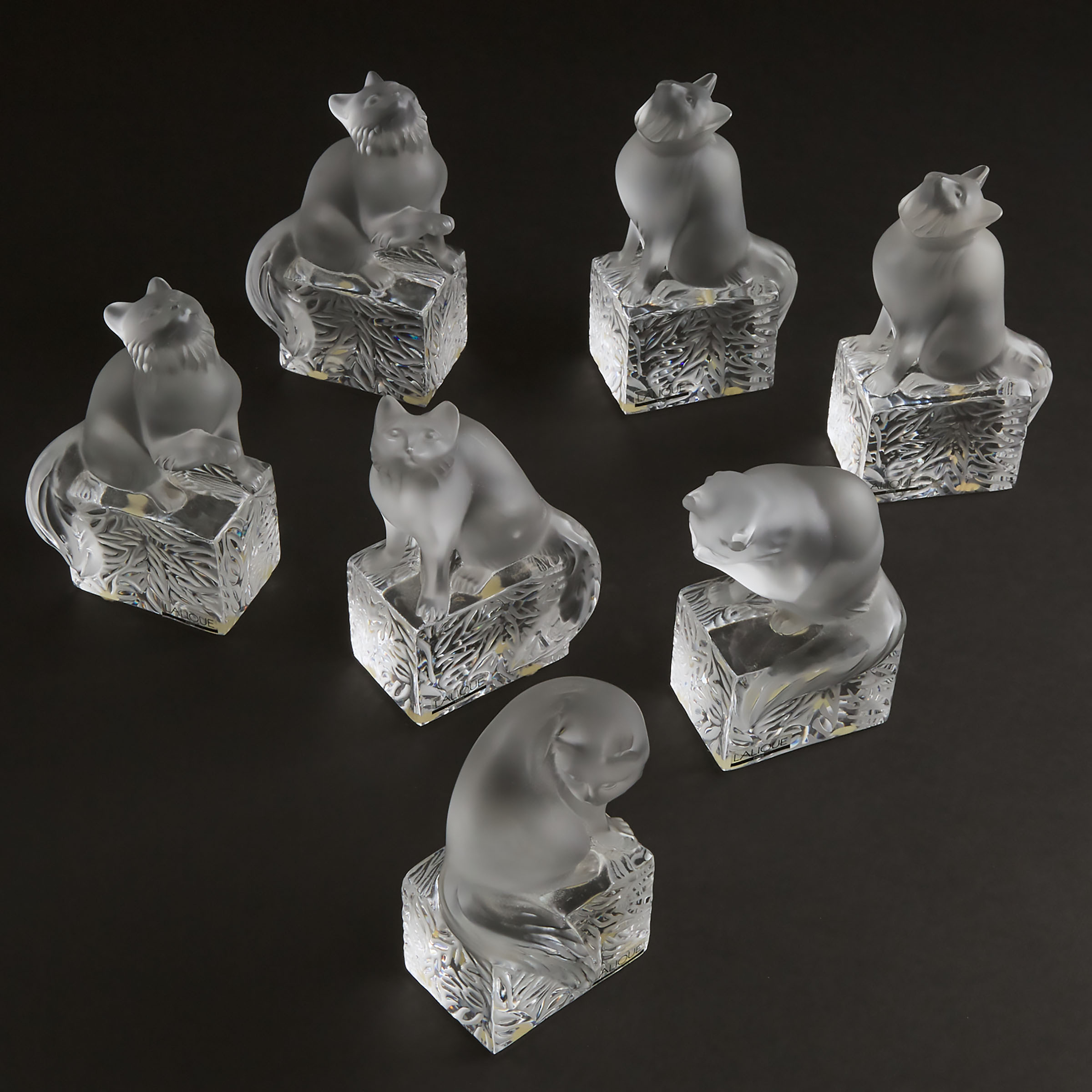 Seven Lalique Moulded and Frosted Glass Cat Paperweights, post-1945