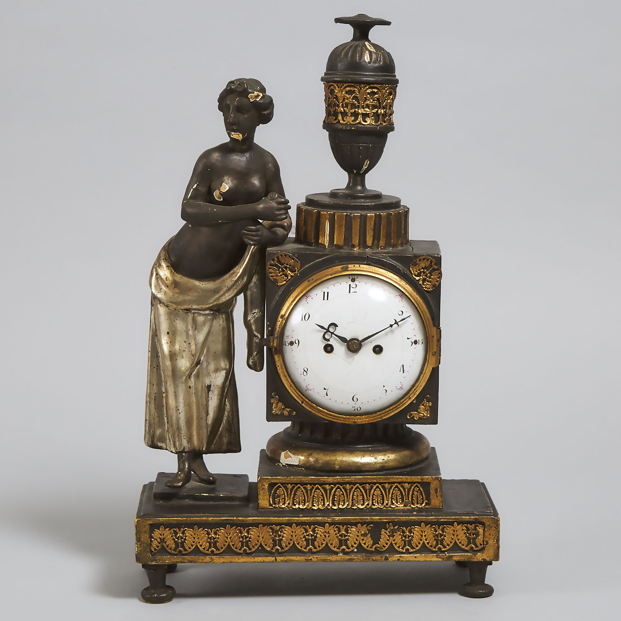 Austrian Greek Revival Carved, Ebonized and Parcel Silver Gilt Figural  Mantle Clock, early 19th century