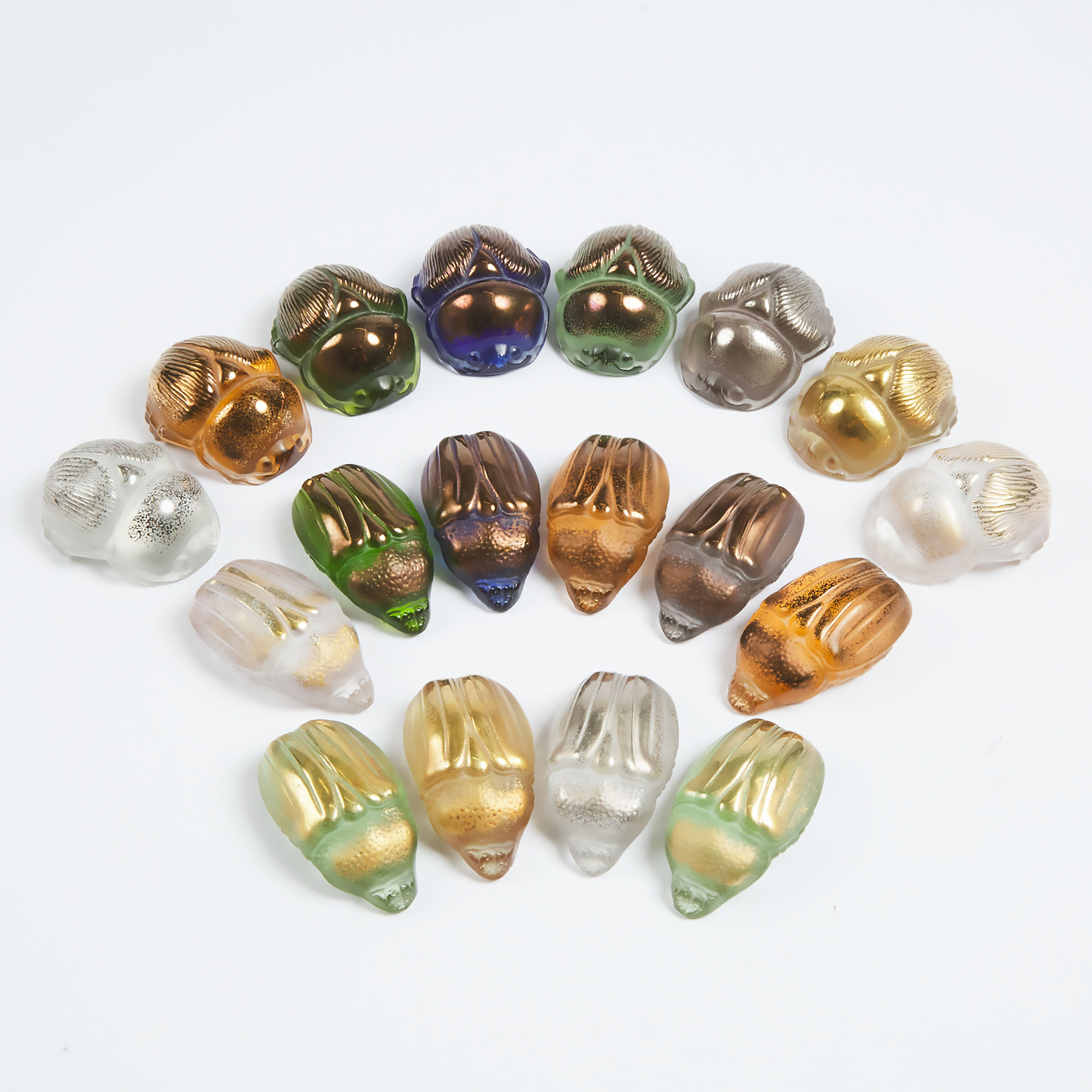 Eighteen Lalique Moulded, Coloured, and Gilt Glass Scarab Beetles, post-1945