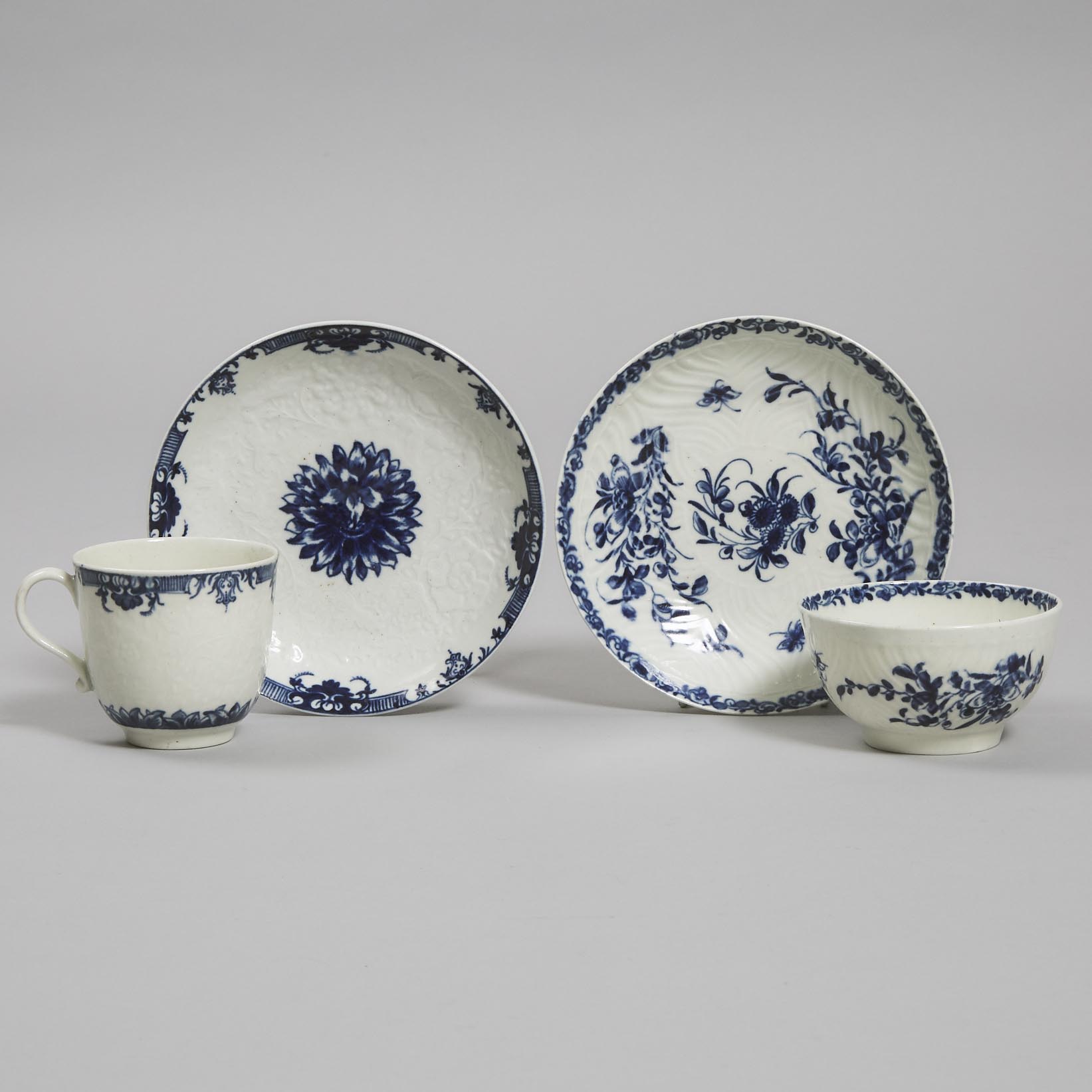 Worcester 'Feather Mould Floral' Tea Bowl and Saucer and a 'Chrysanthemum' Pattern Coffee Cup and Saucer, c.1765-70