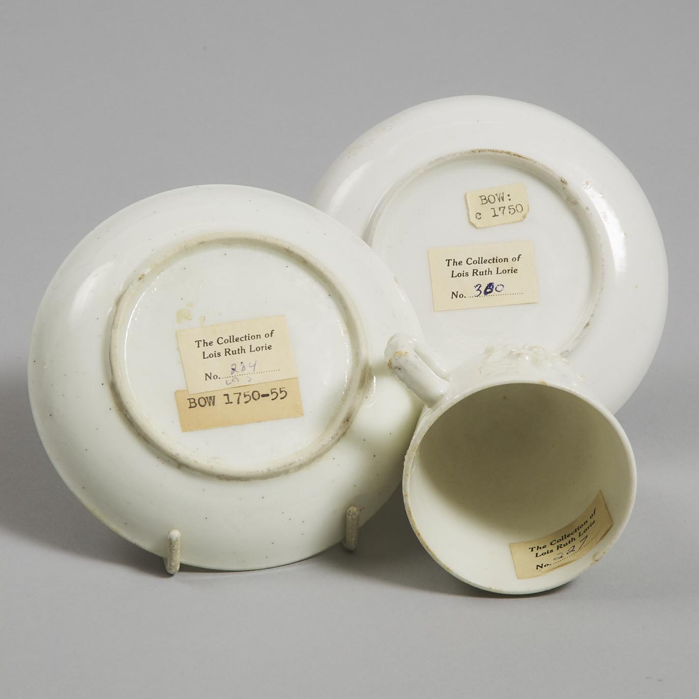 Two Bow Moulded and White Glazed Prunus Cups and a Tea Bowl and Three Saucers, c.1752-55