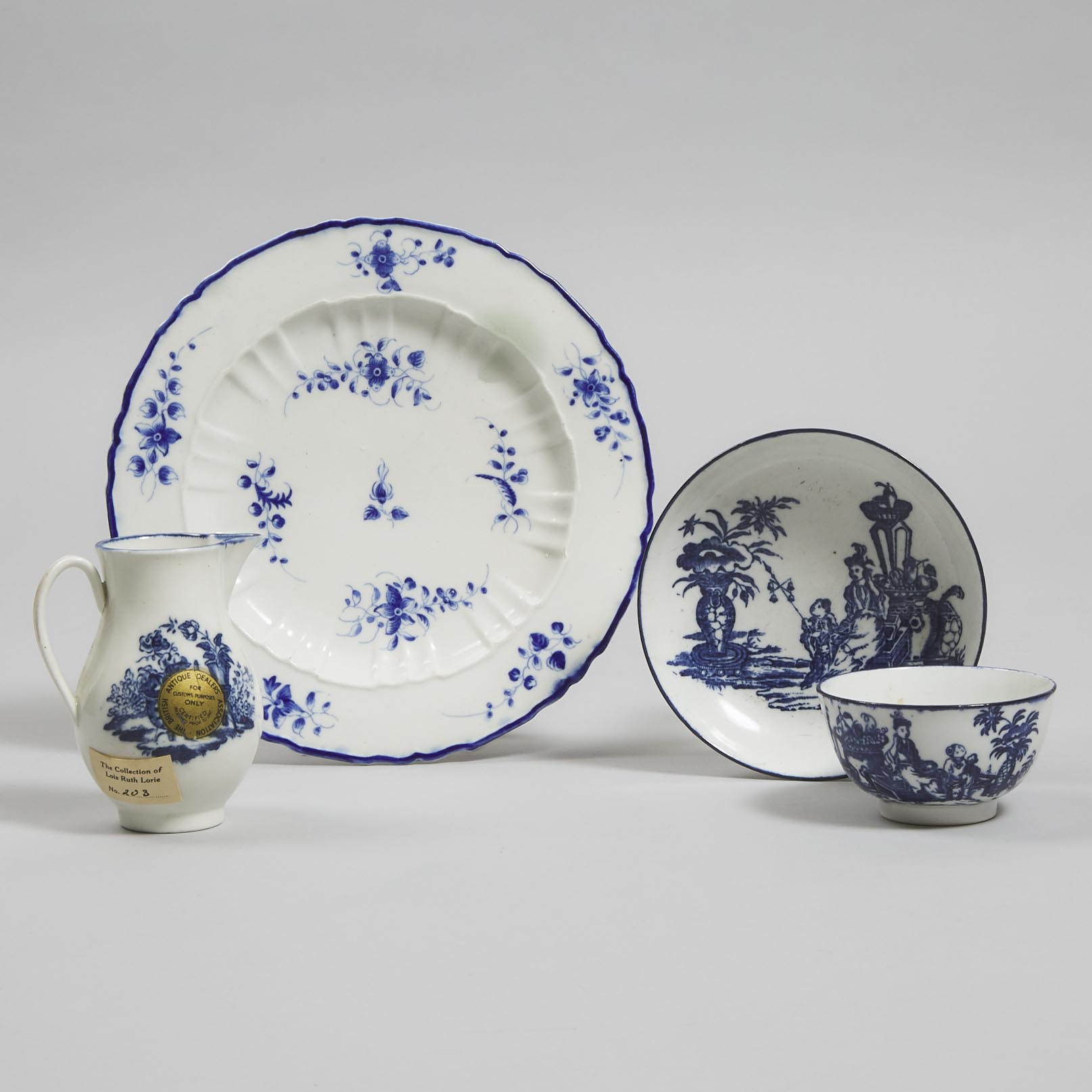 Caughley Blue Printed 'Mother and Child' Cream Jug and a Tea Bowl and Saucer, and a Painted 'Chantilly Sprig' Pattern Plate, c.1780-85