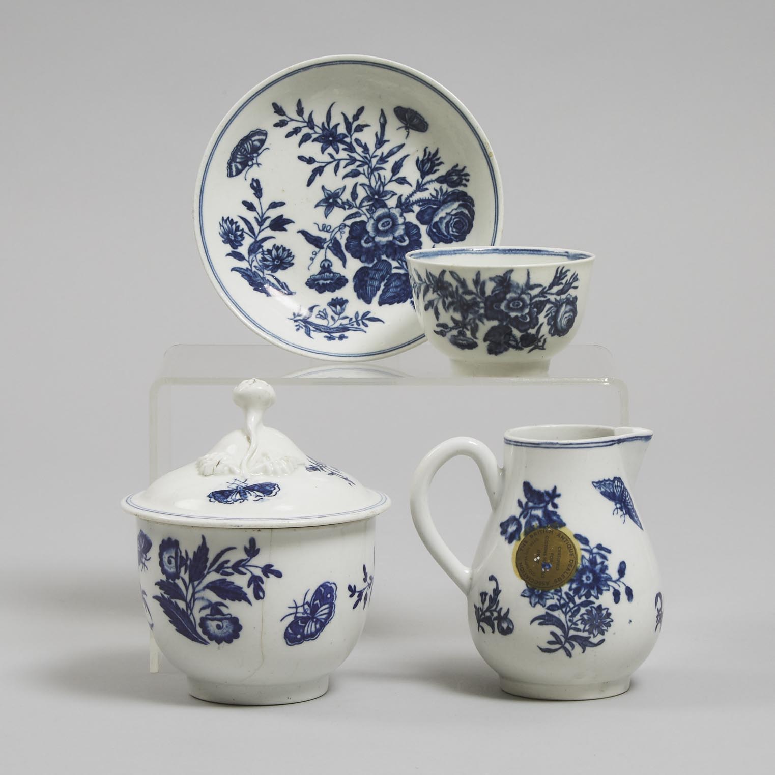 Worcester 'Three Flowers' Pattern Covered Sugar Bowl, Cream Jug, Tea Bowl and Saucer, c.1775