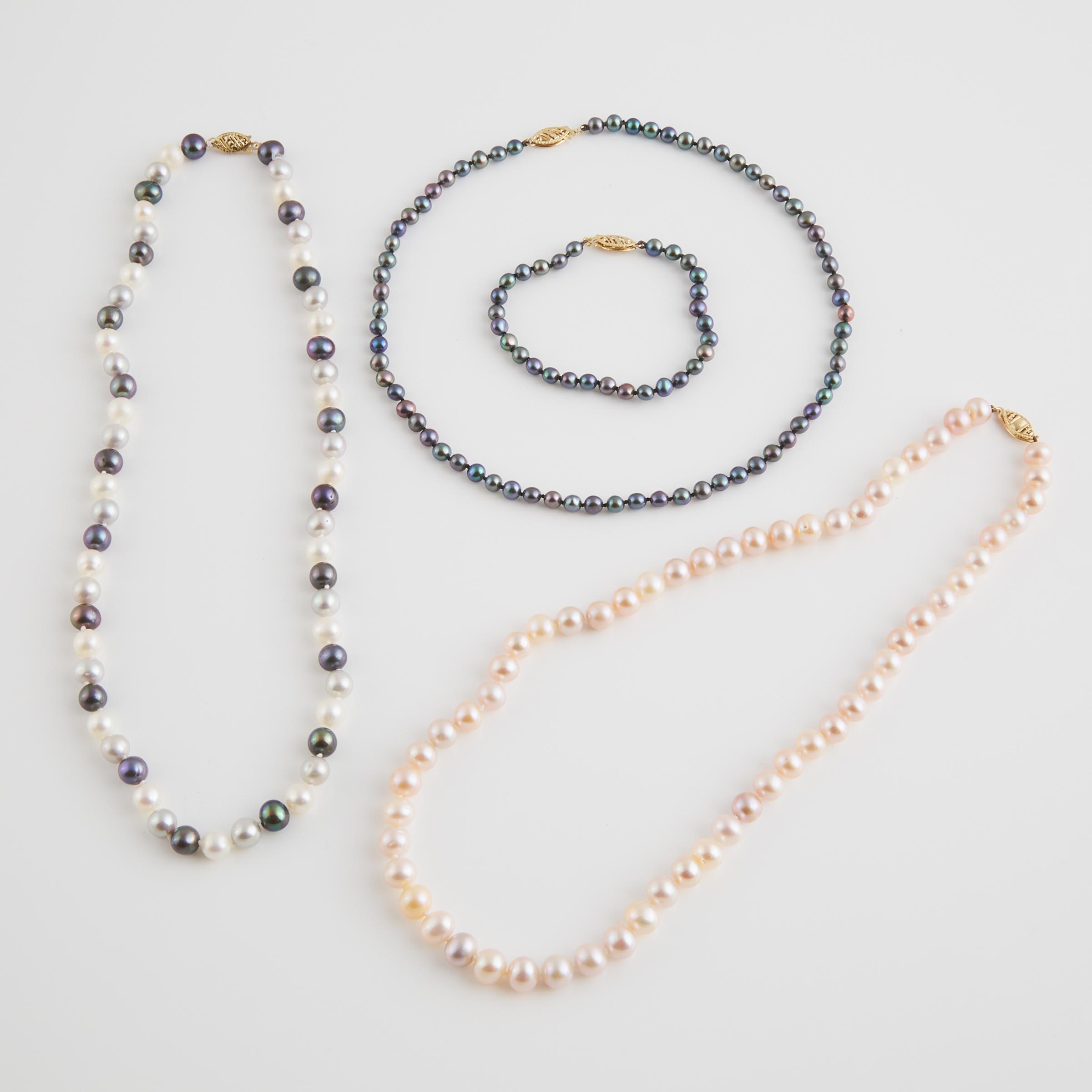 4 Single Strands Of Various Cultured Pearls