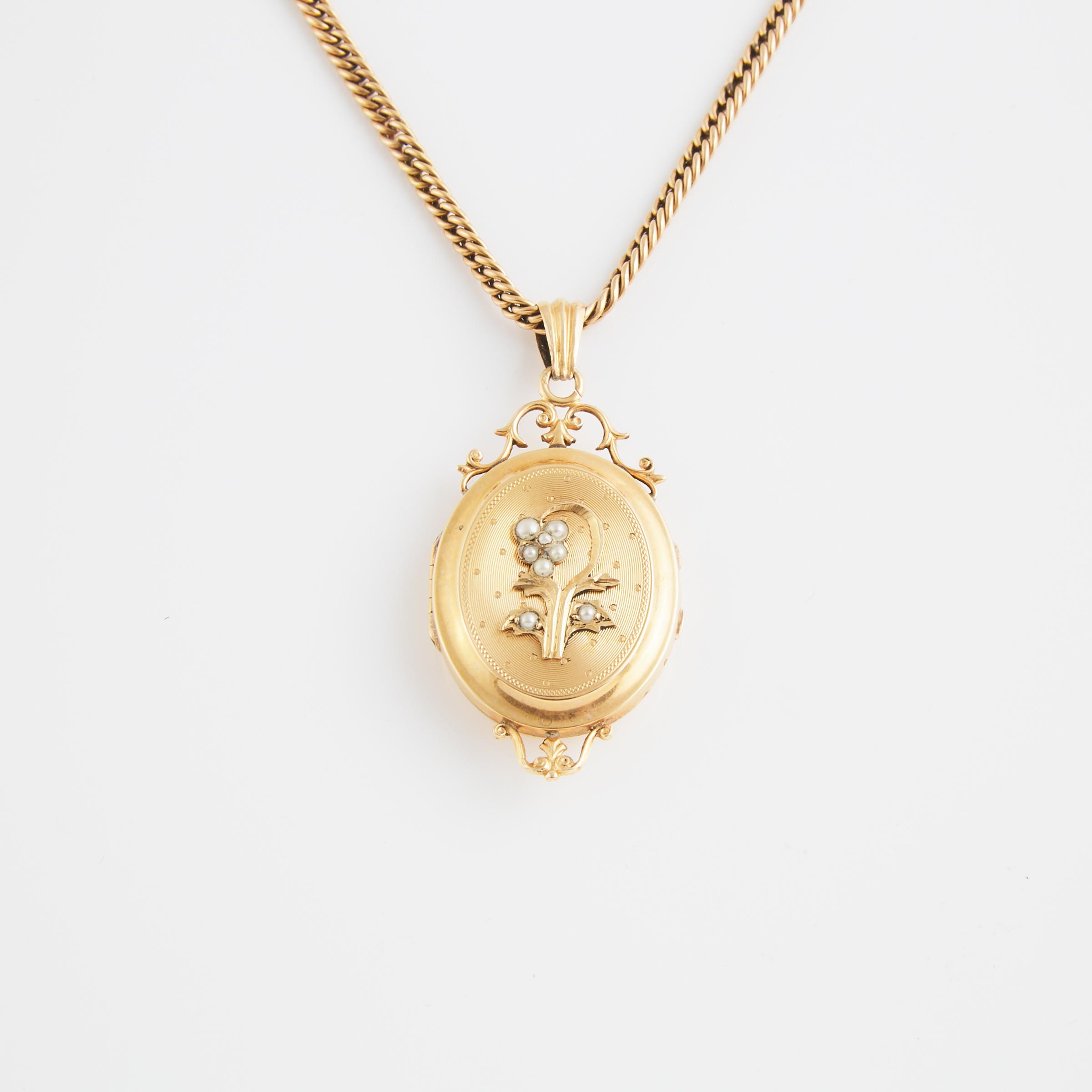 18k Yellow Gold Locket And A 14k Yellow Gold Chain