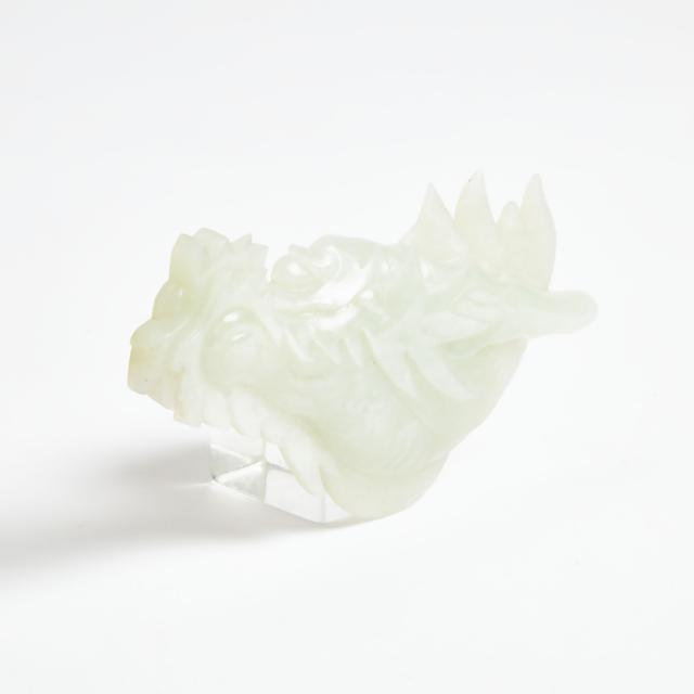 A White Jade Plaque of a Dragon's Head, Qing Dynasty, 18th Century