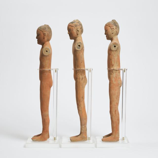 A Group of Three Pottery Figures of Male Warriors, Han Dynasty (206 BC-220 AD)