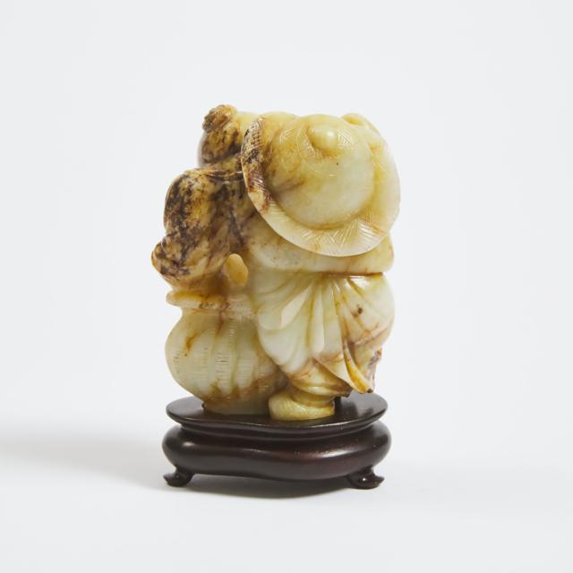 A White and Russet Jade Figure of a Fisherman, Late Qing/Republican Period, 19th/20th Century