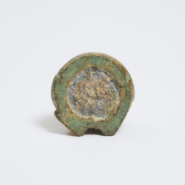A Gilt Bronze 'Tiger' Circular Mat Weight, Han Dynasty (206 BC-220 AD)