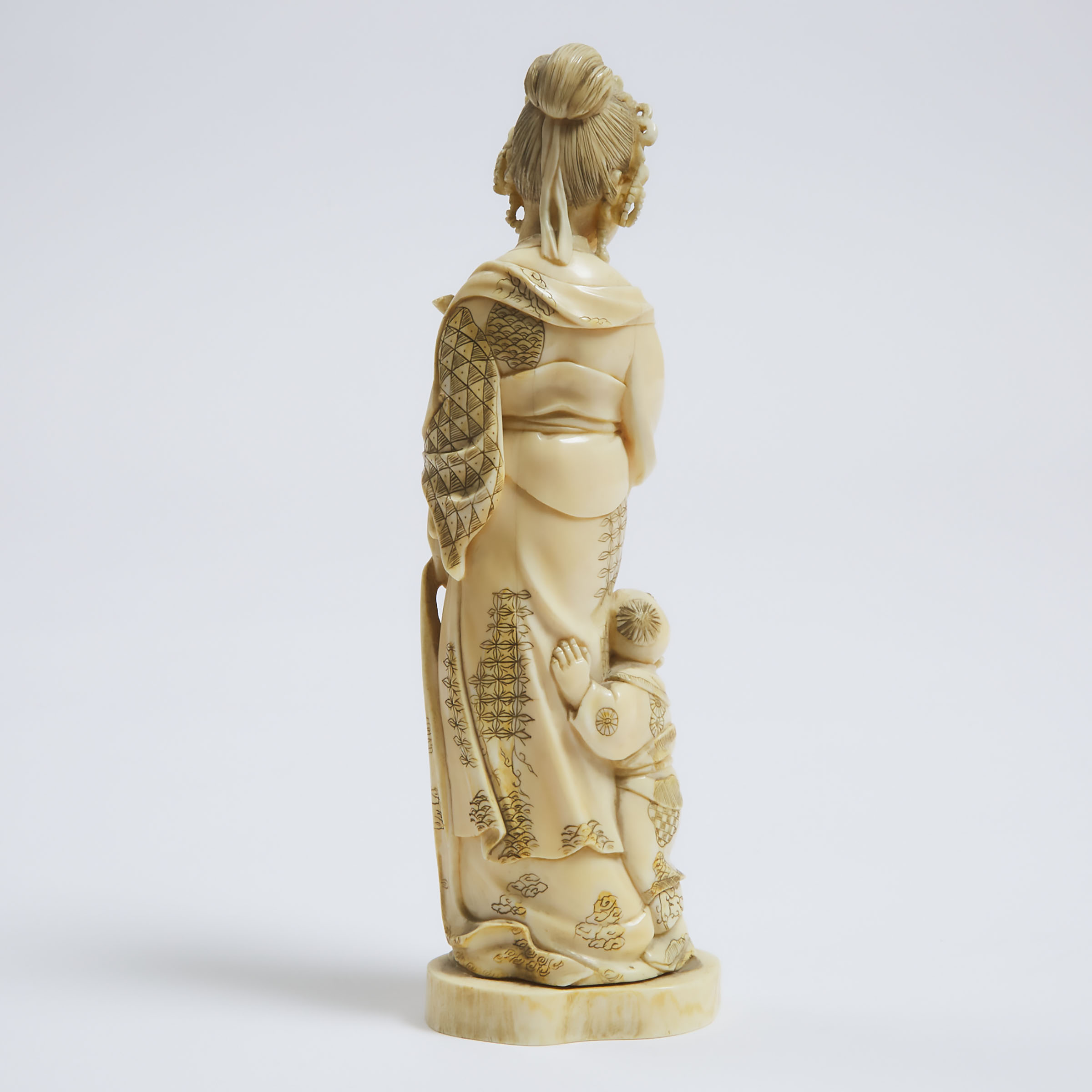 A Carved Ivory Group of a Lady and Child, Signed Gyokushi, Meiji Period (1868-1912)