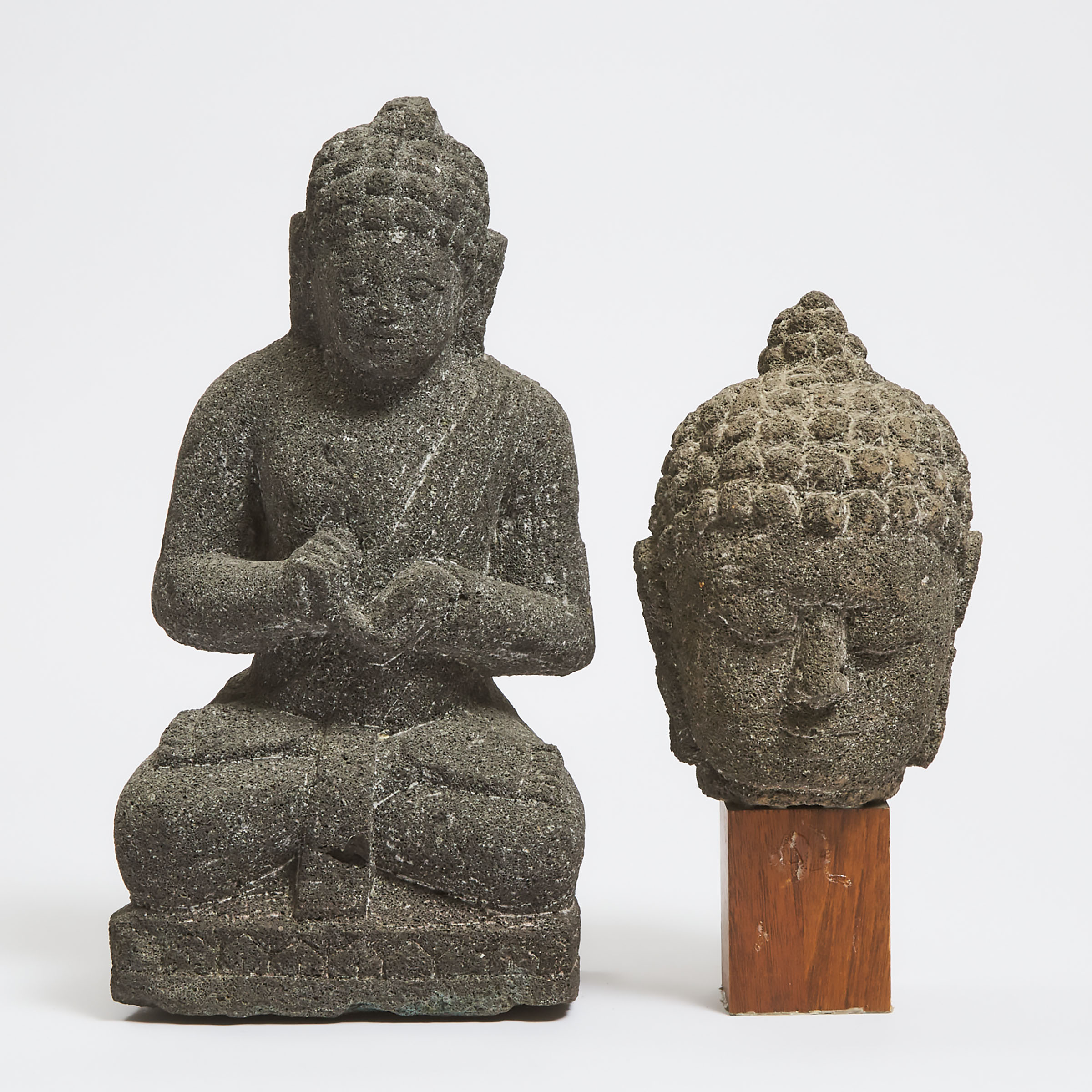 Two Javanese Volcanic Stone Carvings of Buddha, 14th Century
