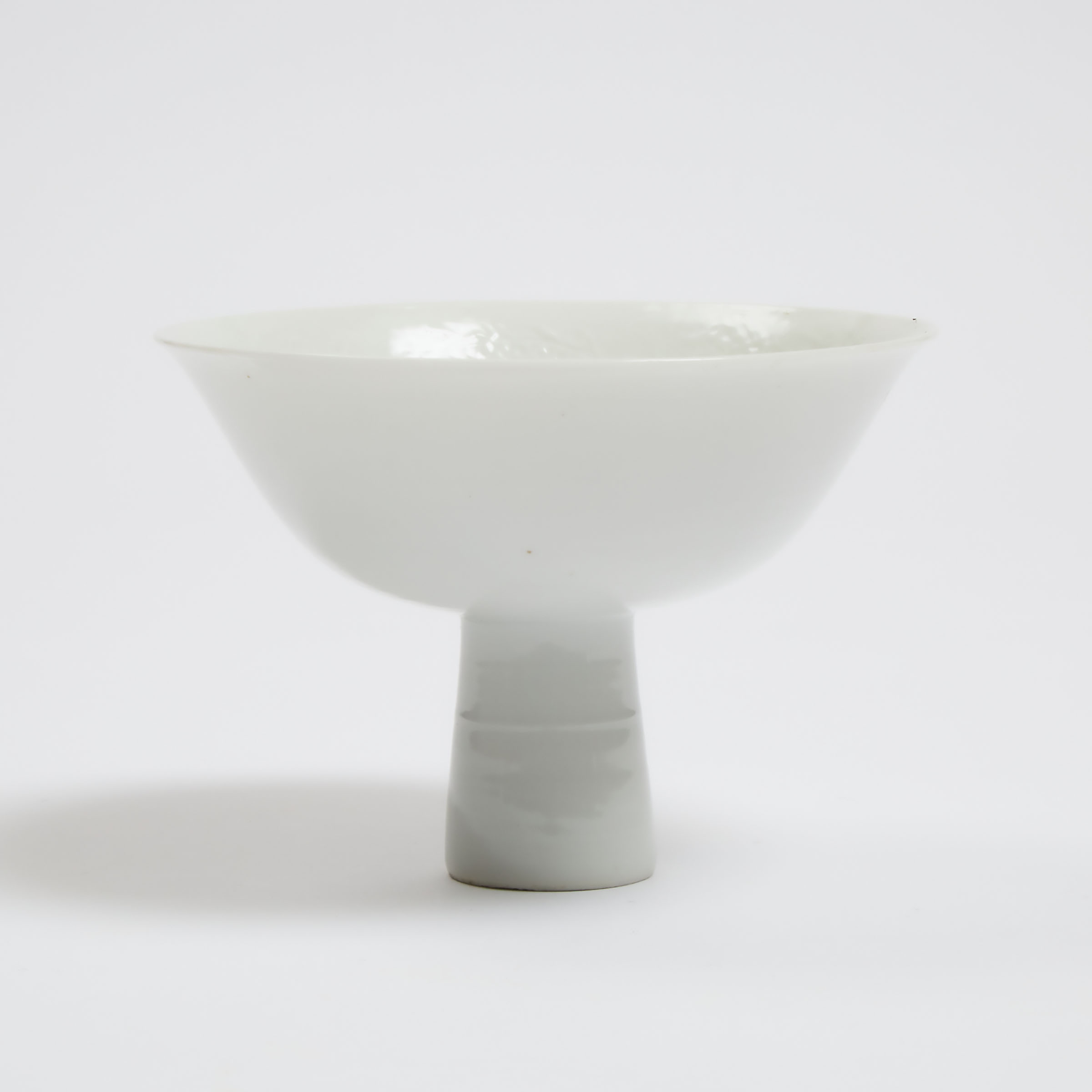 An Anhua-Decorated White-Glazed 'Dragon' Stem Bowl, Qing Dynasty, 18th Century