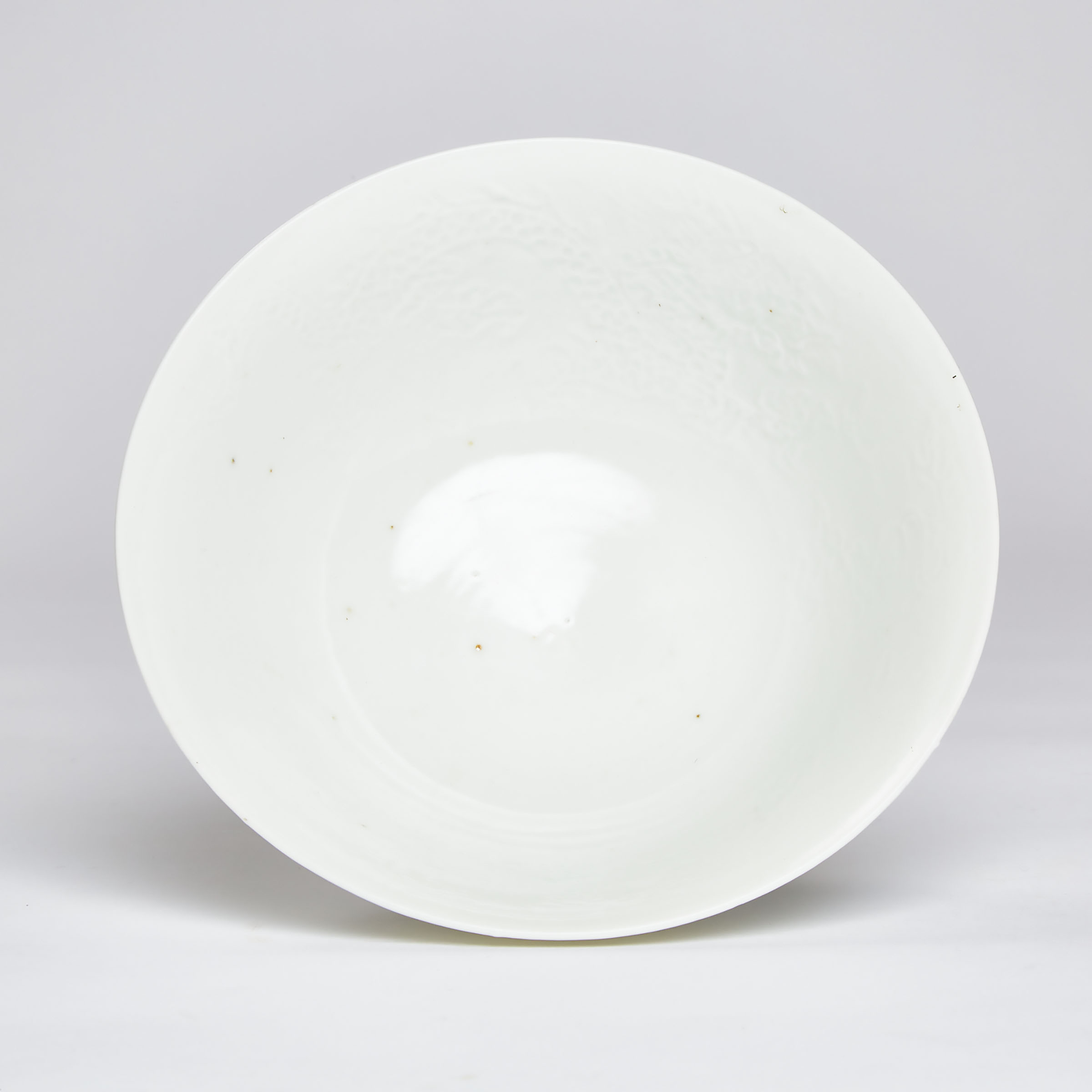 An Anhua-Decorated White-Glazed 'Dragon' Stem Bowl, Qing Dynasty, 18th Century