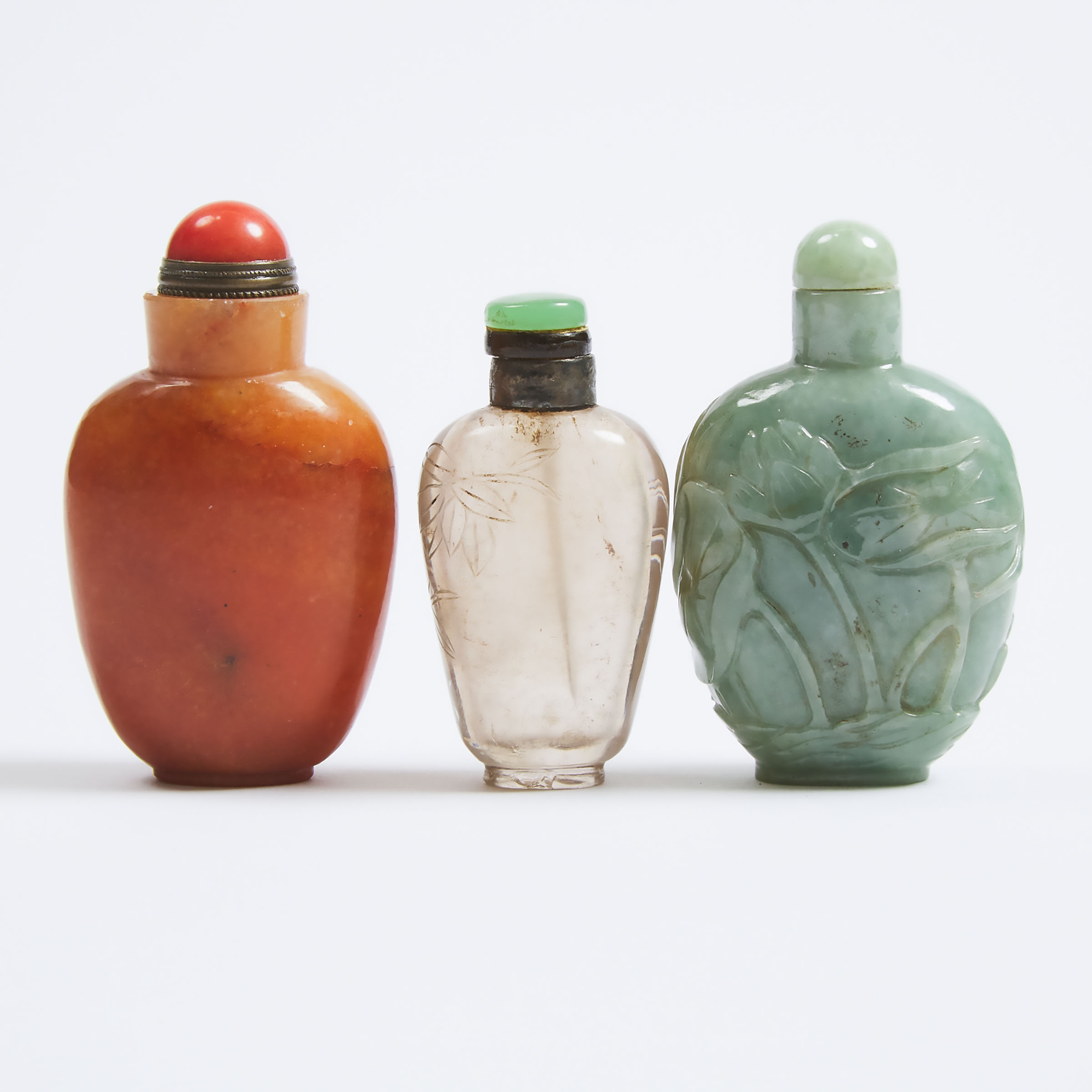 A Group of Three Agate, Jadeite, and Smoky Quartz Snuff Bottles, Republican Period, Early 20th Century