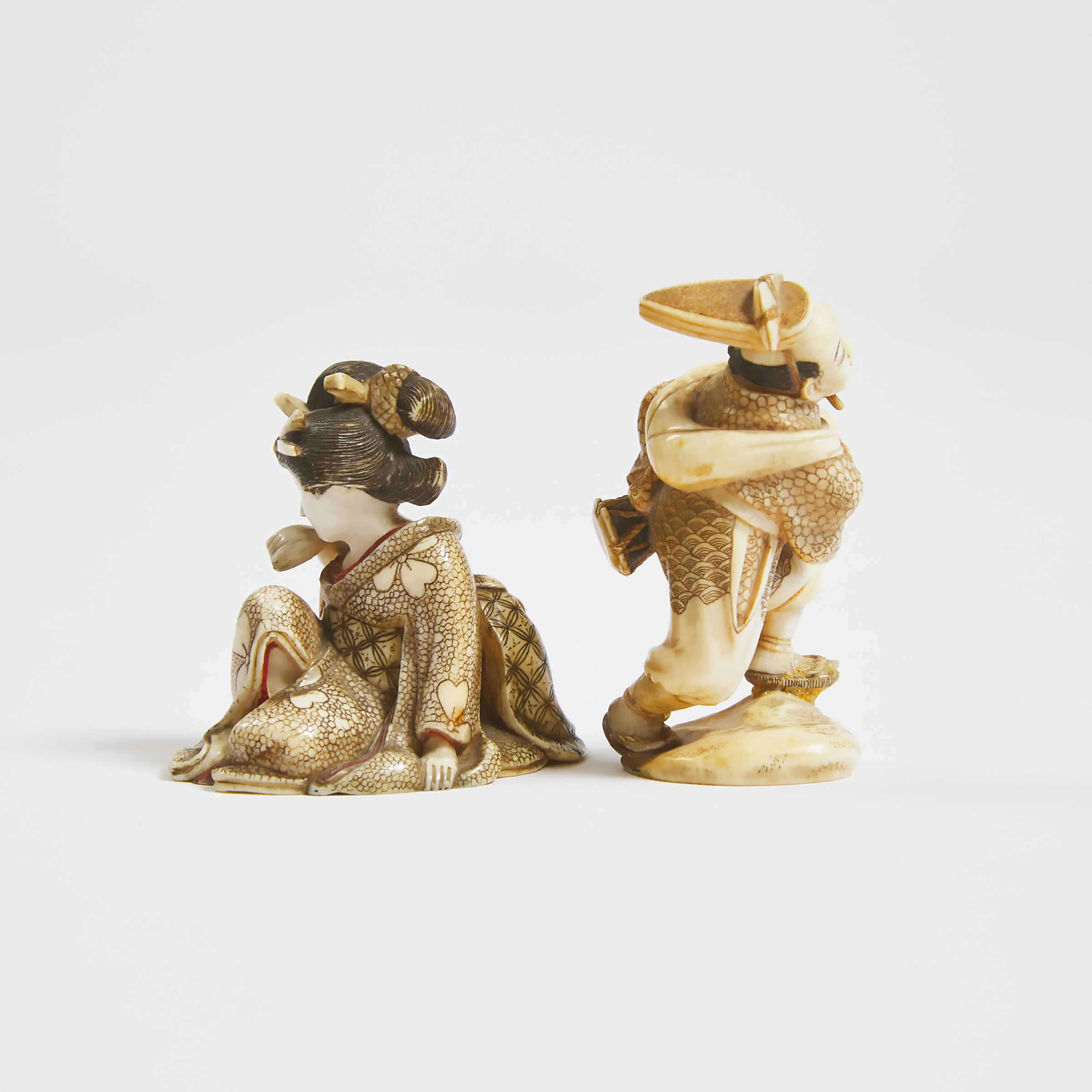 Two Tinted Ivory Netsuke of a Court Drummer and a Geisha, Both Signed, Meiji Period (1868-1912)