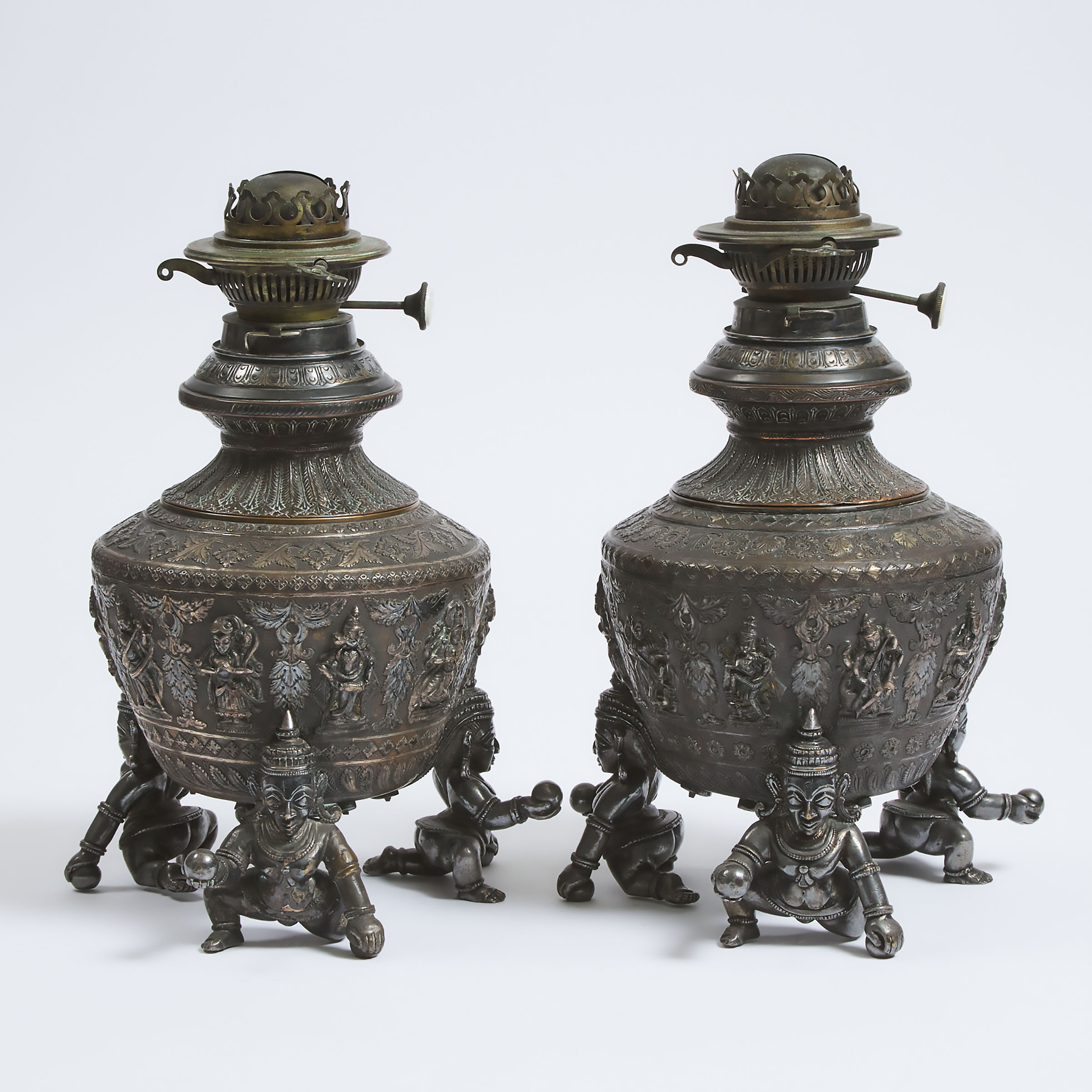 A Pair of Indian Silvered Copper Lamps, 19th/Early 20th Century