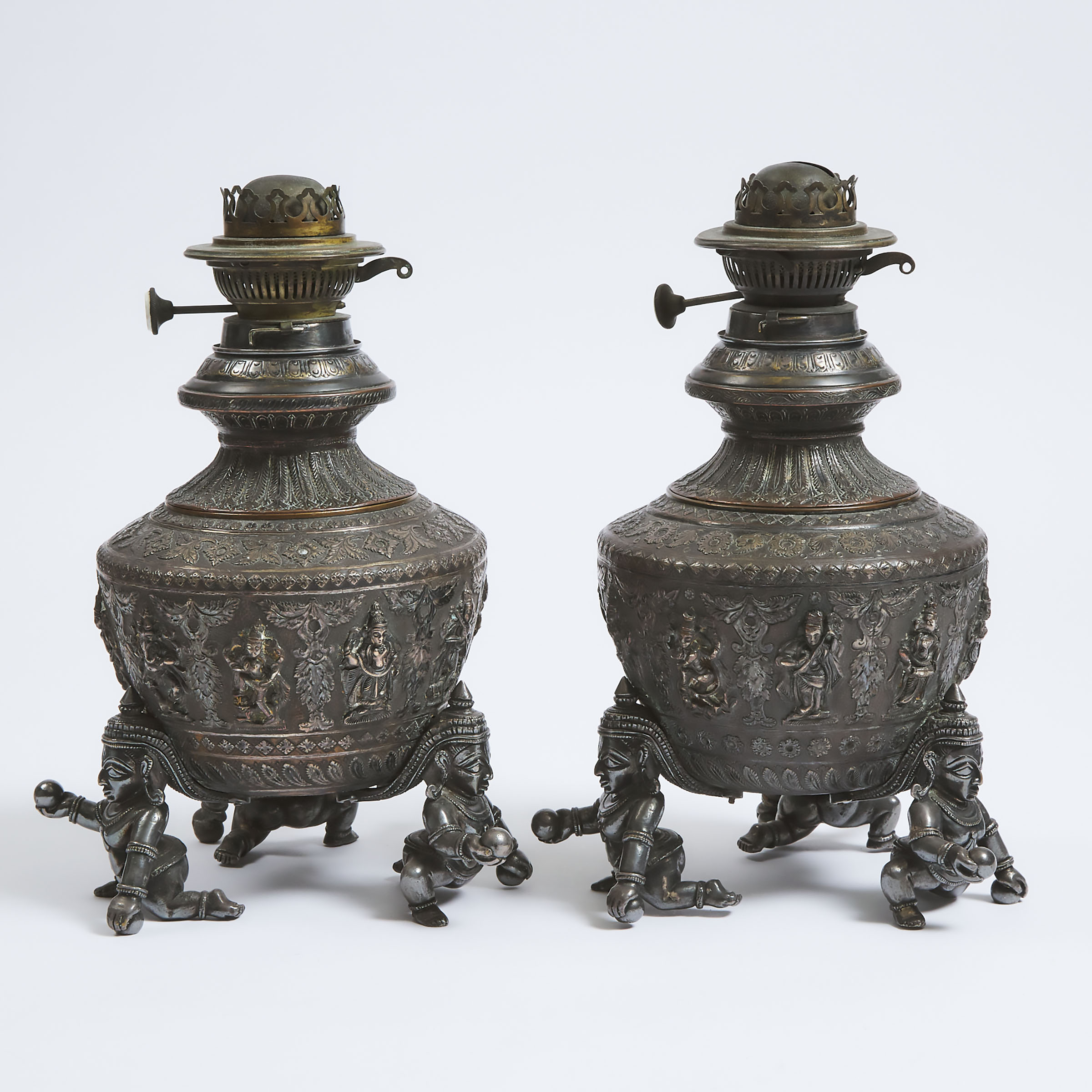 A Pair of Indian Silvered Copper Lamps, 19th/Early 20th Century
