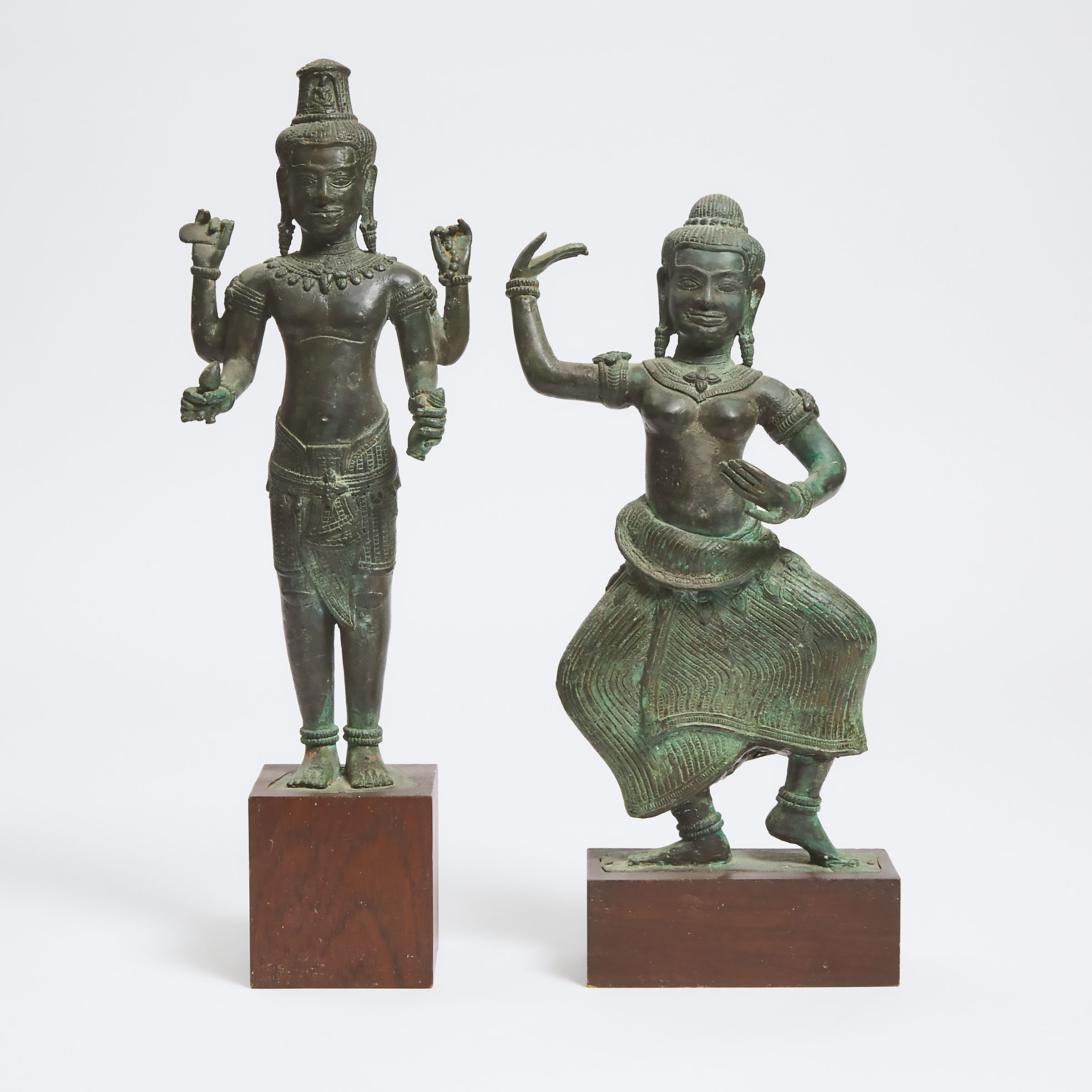 Two Khmer Bronze Figures of a Four-Armed Deity and a Dancer, 18th Century or Later