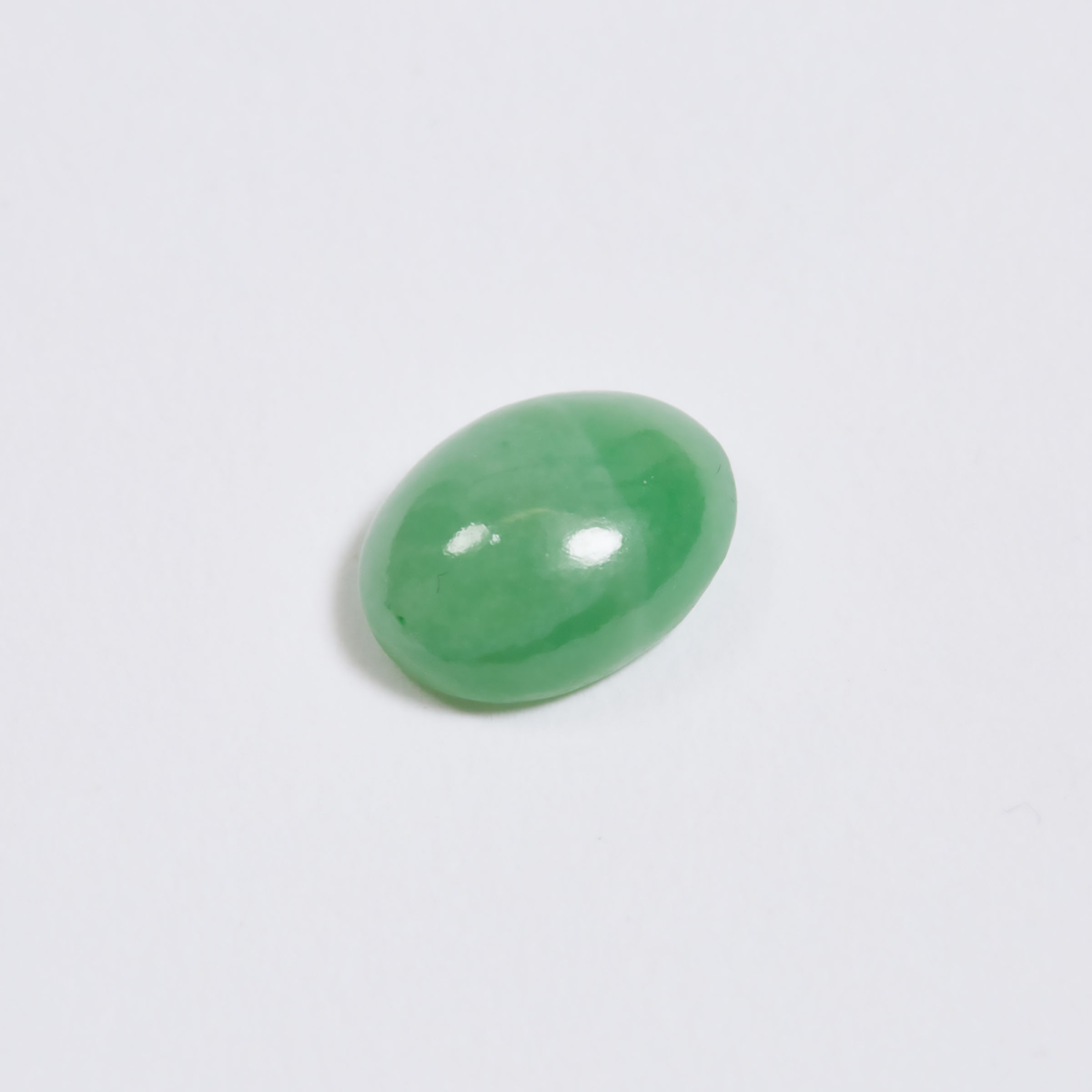 An Unmounted Natural Oval Jadeite Cabochon