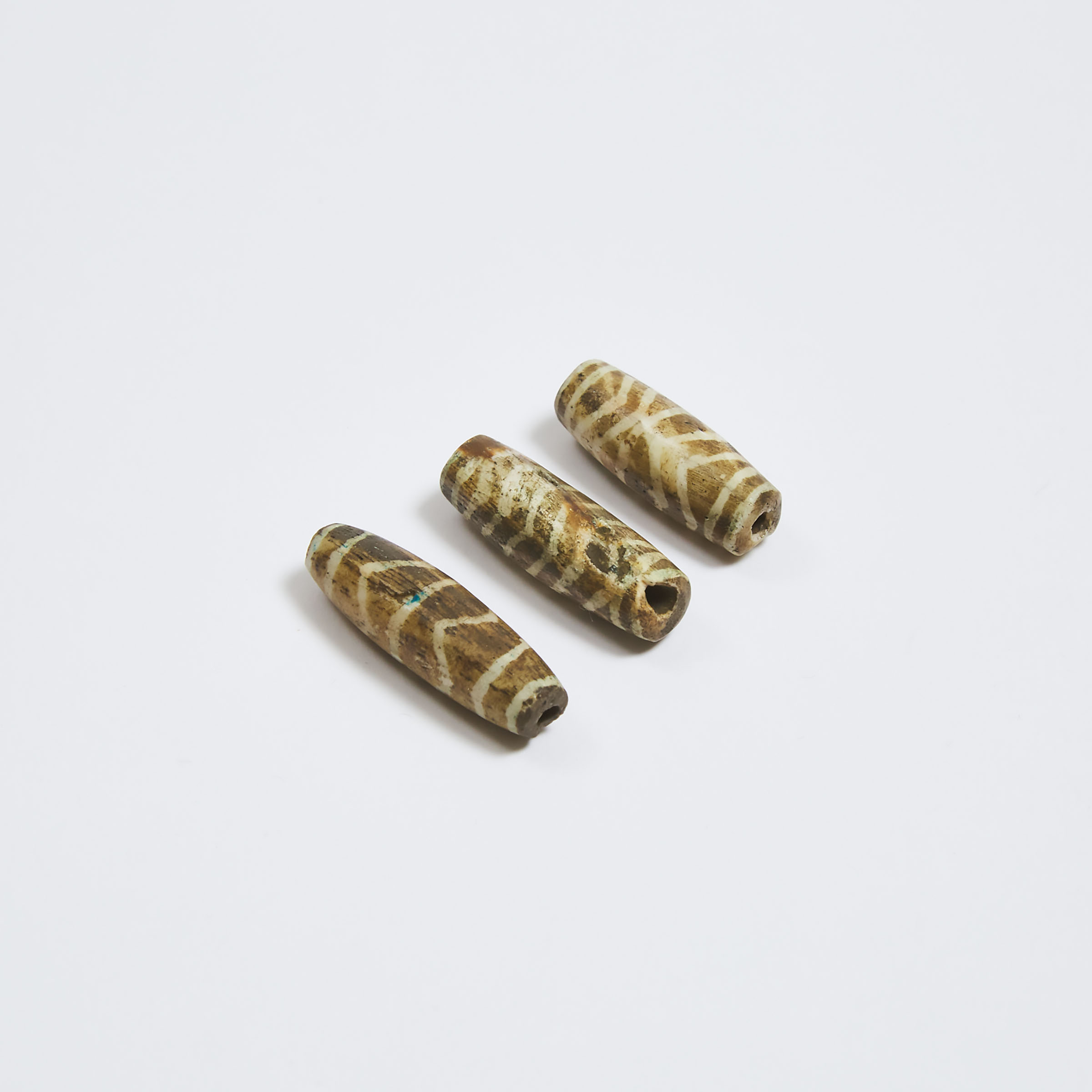 Three Burmese Pumtek 'Zig Zag Tiger' Tubular Beads
