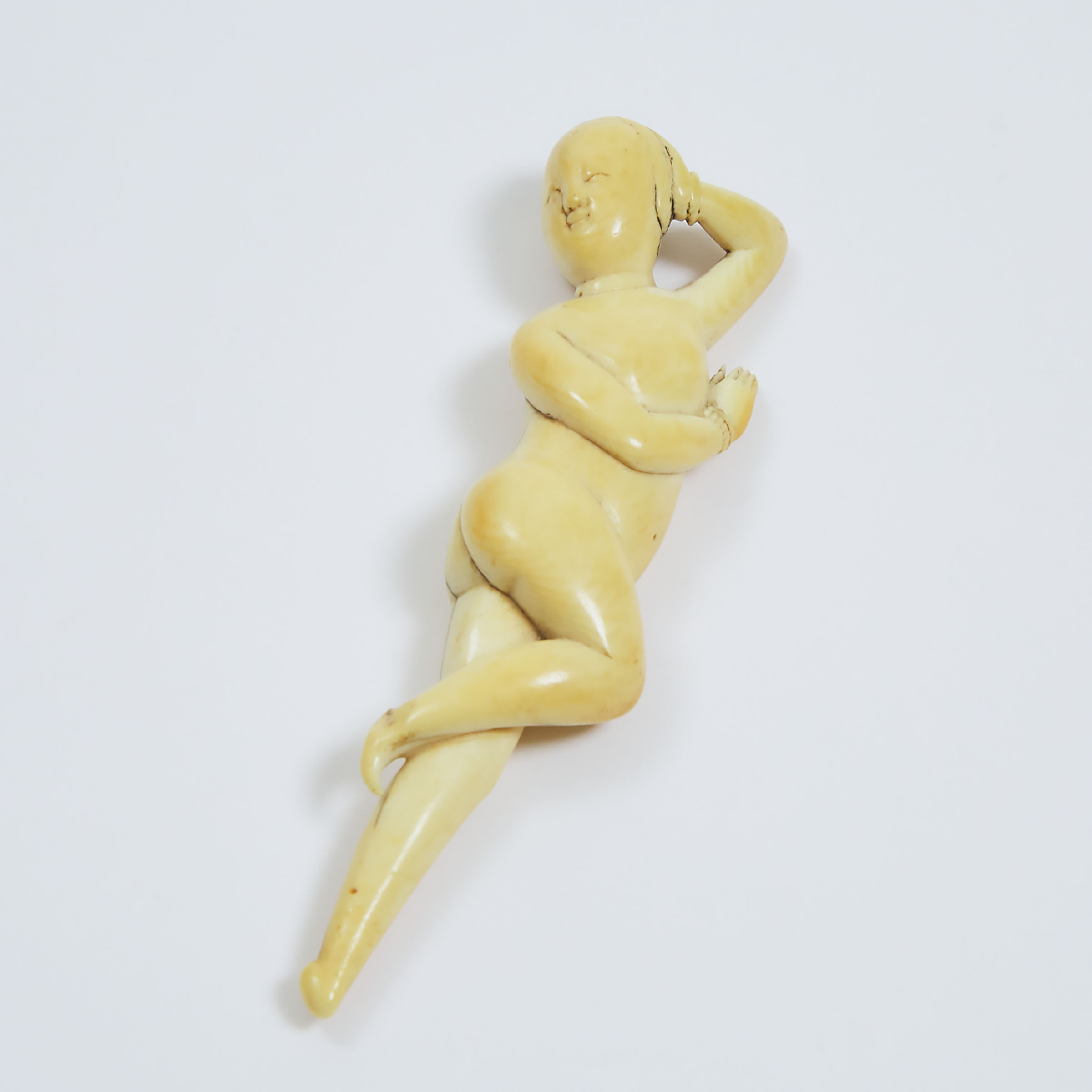 A Chinese Ivory Figure of a Reclining Nude, 'Medicine/Doctor's Doll', Shunzhi-Kangxi Period (1644-1722)