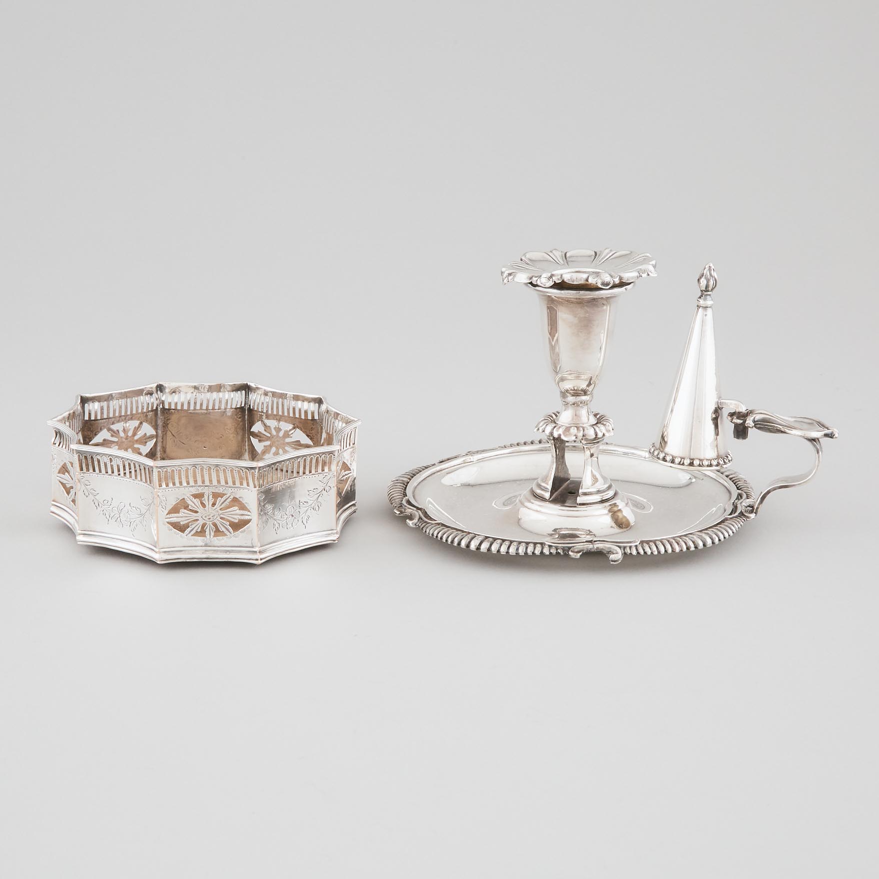 Old Sheffield Plate Wine Coaster and a Victorian Plated Chamberstick, late 18th/19th century