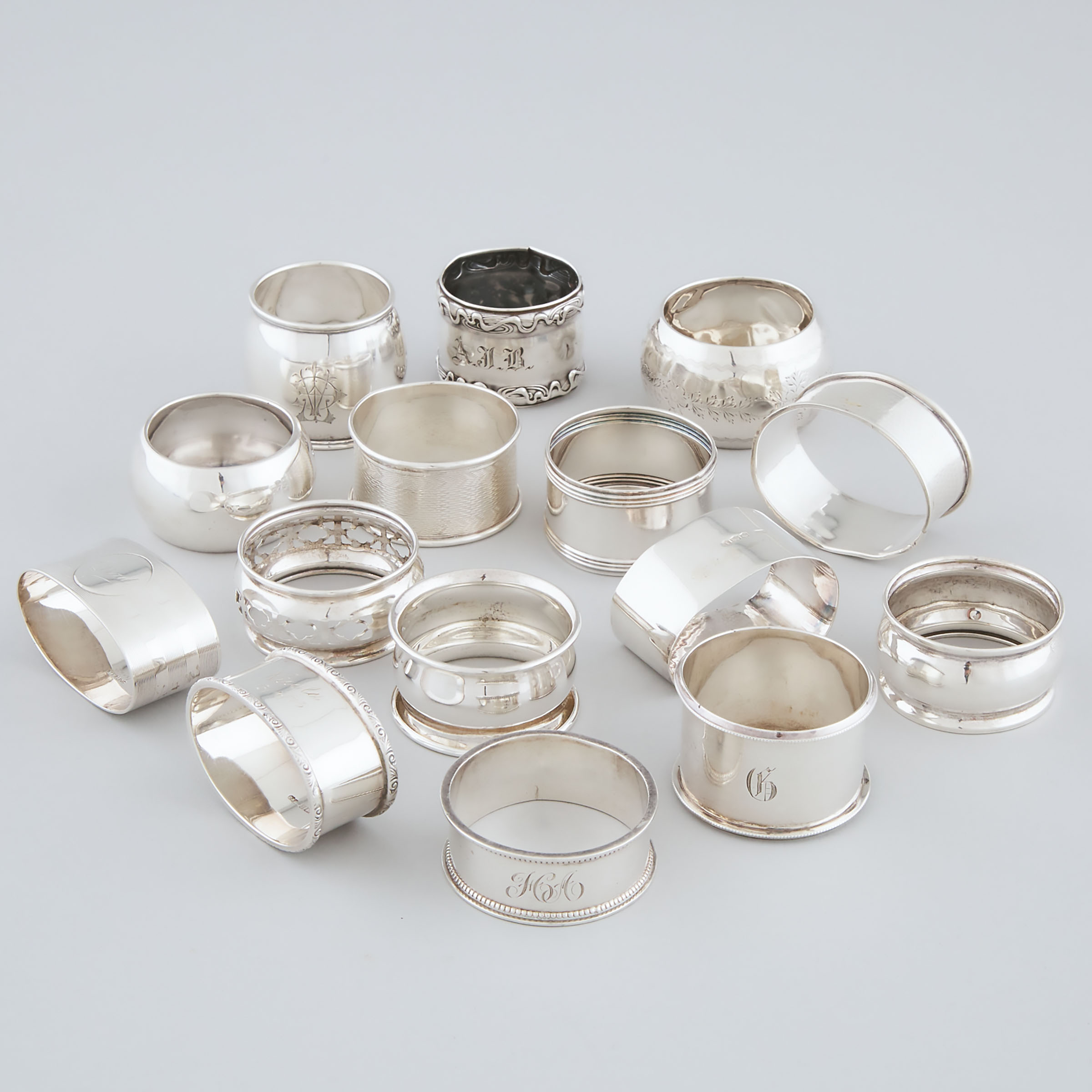 Fifteen Various English and North American Silver Napkin Rings, 20th century