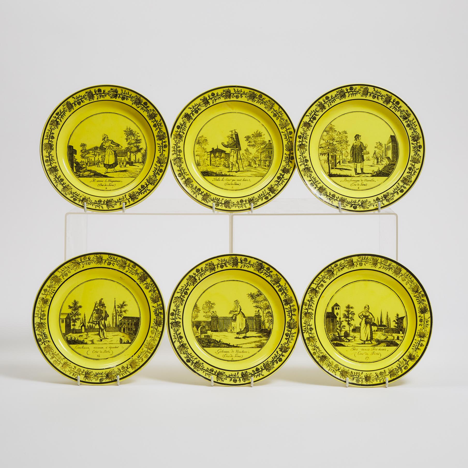 Six Choisy Black Printed Yellow Ground Faience 'Cris de Paris' Plates, 19th century