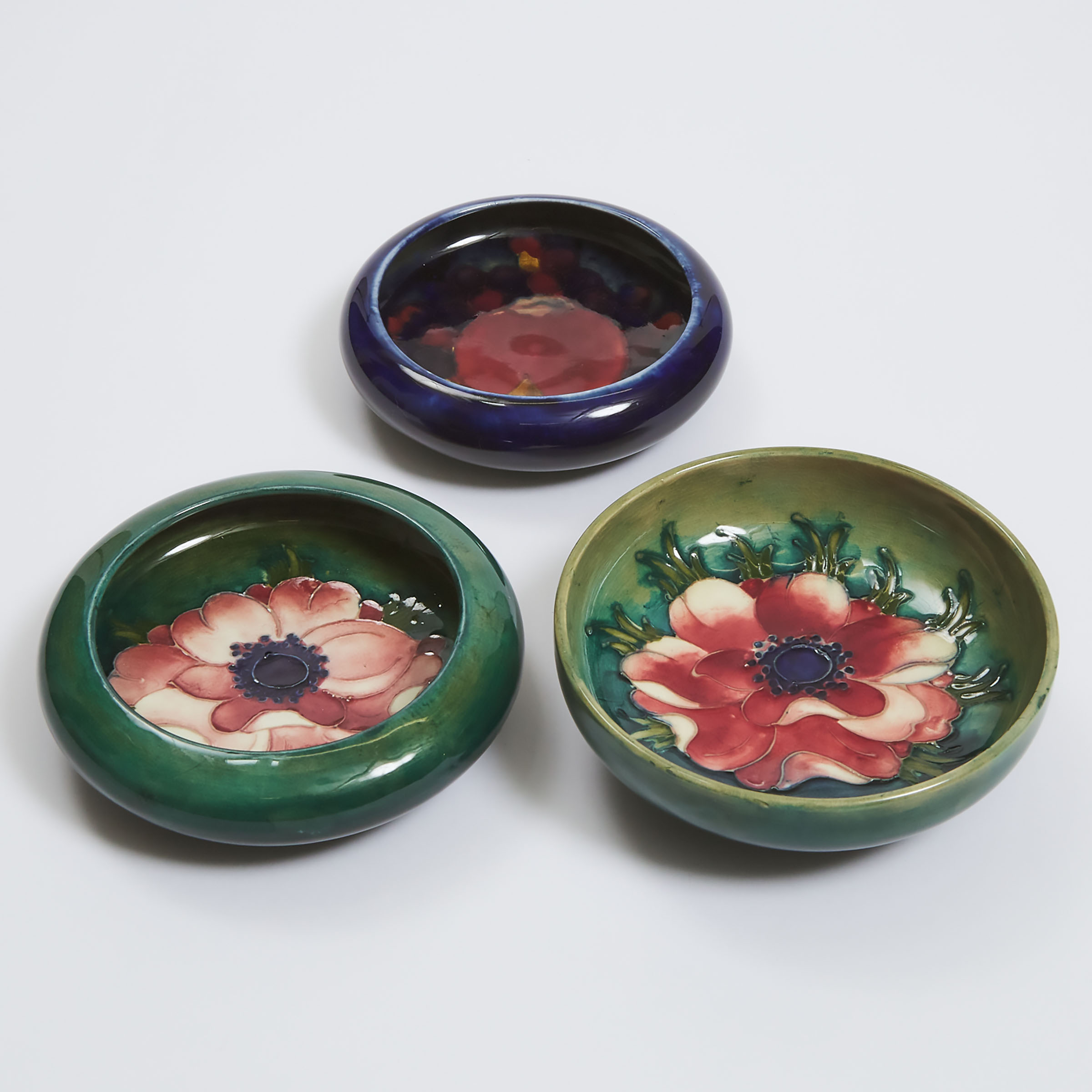 Three Small Moorcroft Anemone and Pomegranate Dishes, mid-20th century