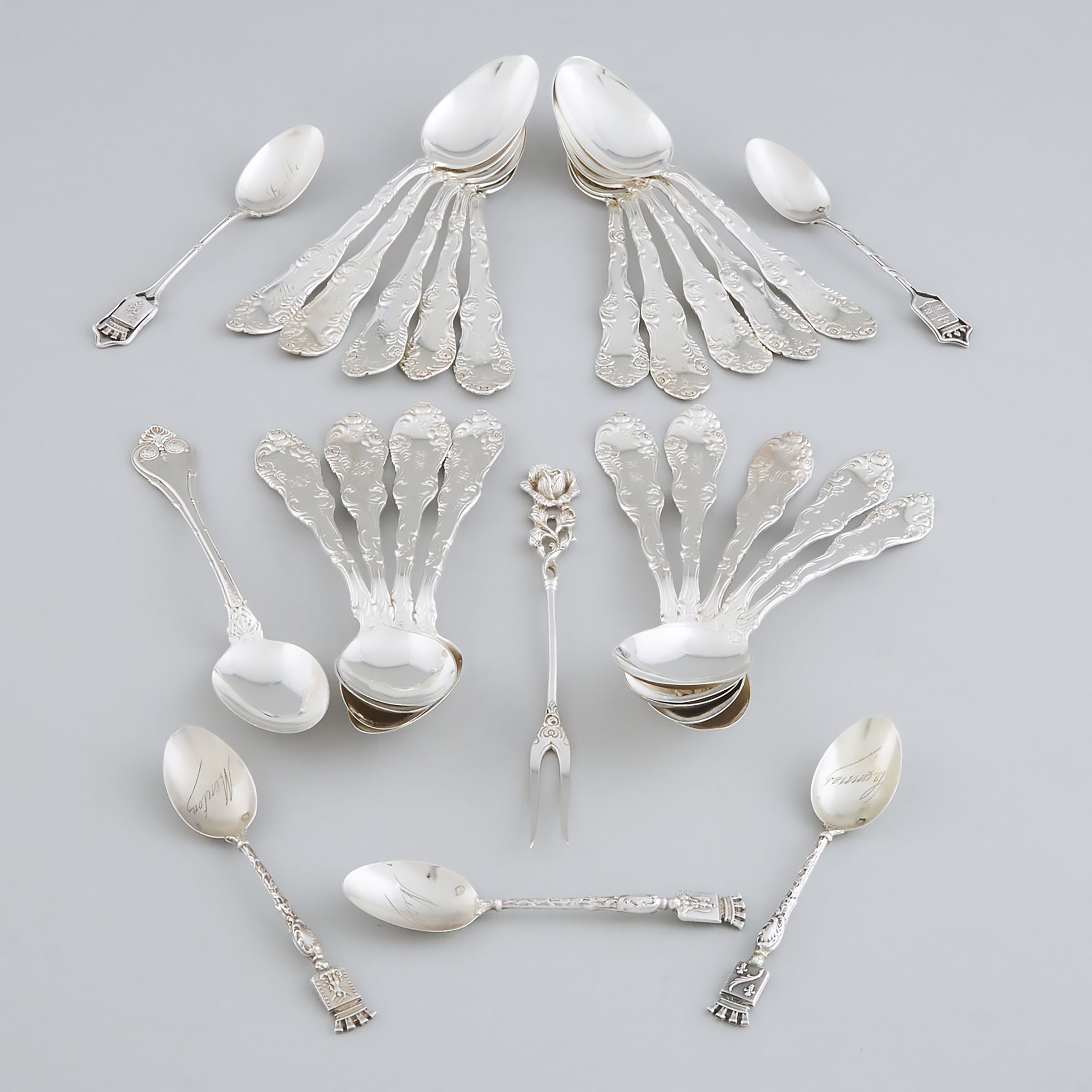 Twenty-Five North American and French Silver Tea and Coffee Spoons and a German Pickle Fork, 20th century