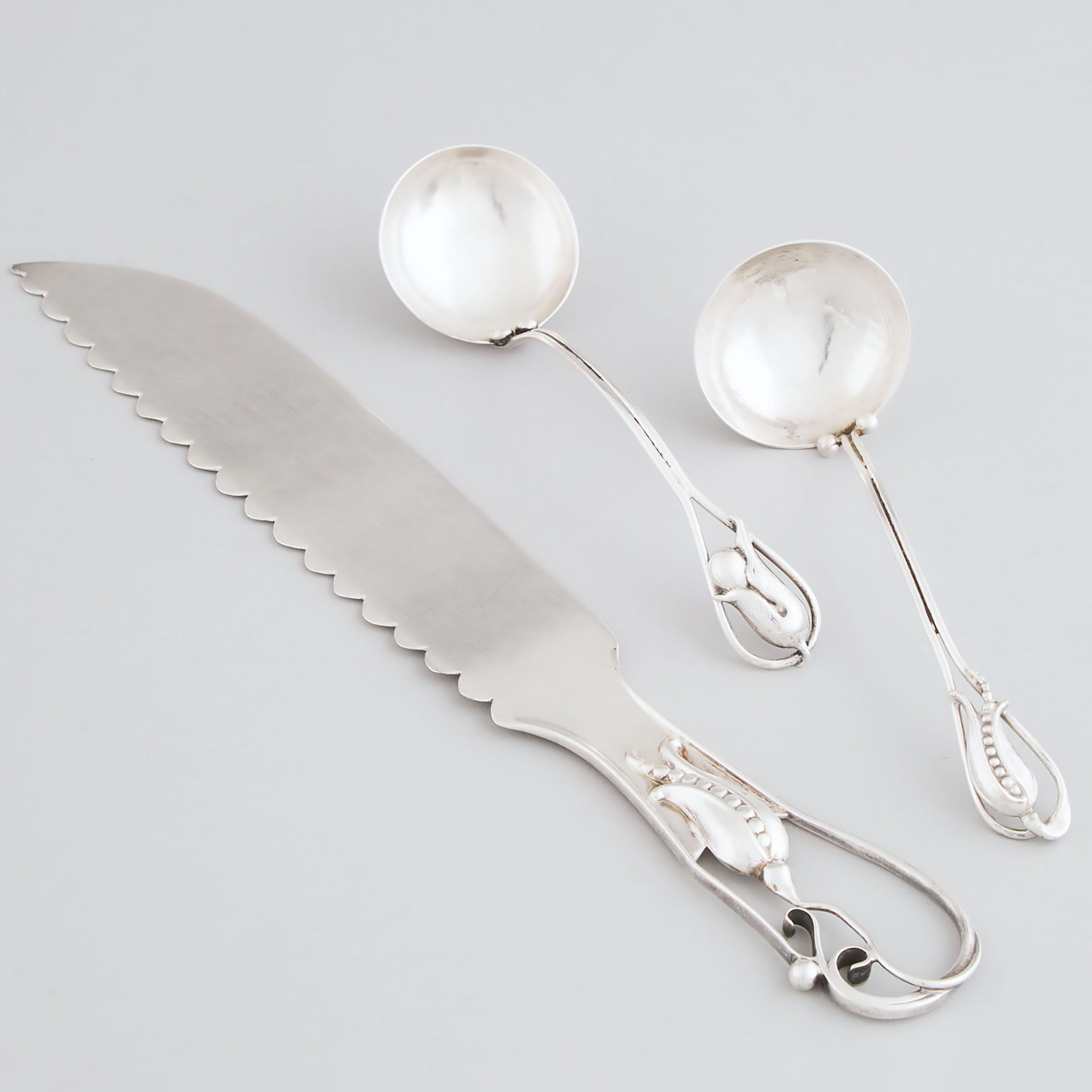 Canadian Silver Cake Knife and Two Sauce Ladles, Poul Petersen, Montreal, Que., mid-20th century