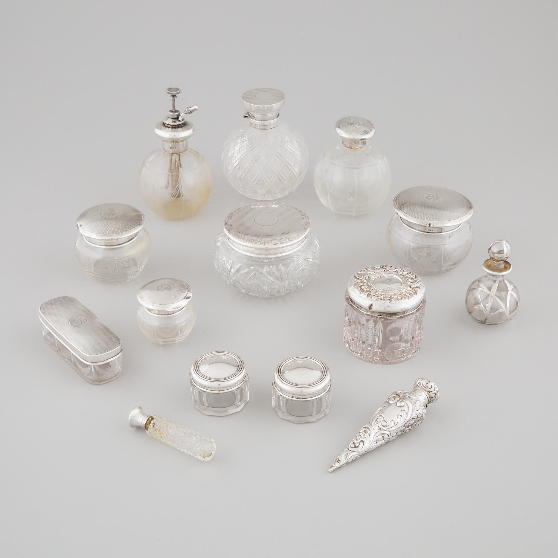 Group of English and North American Silver and Silver Mounted Glass Perfume Phials, Toilet Water Bottles and Dressing Table Jars, 20th century