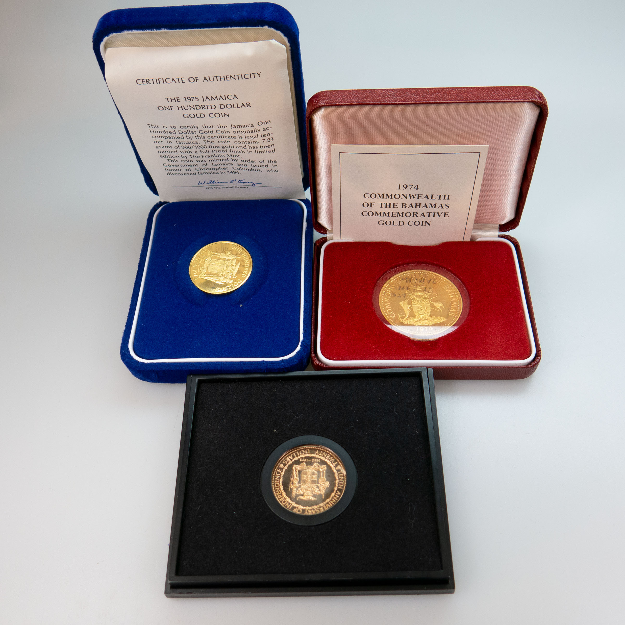 Three Gold Coins In Cases
