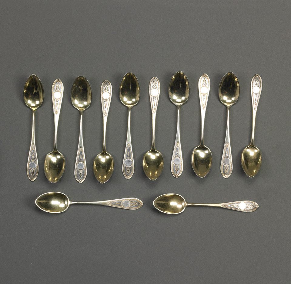 Twelve Russian Nielloed Silver-Gilt Tea Spoons, Moscow, 1870/78