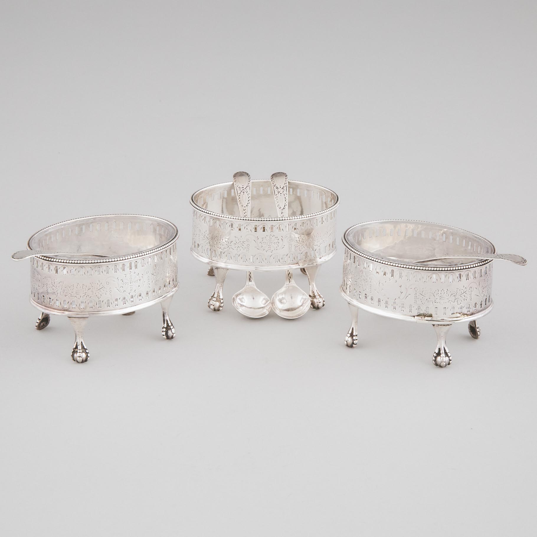 Three George III Silver Oval Salt Cellars, James Waters, London, 1787 and Four Spoons, Hester Bateman, 1788
